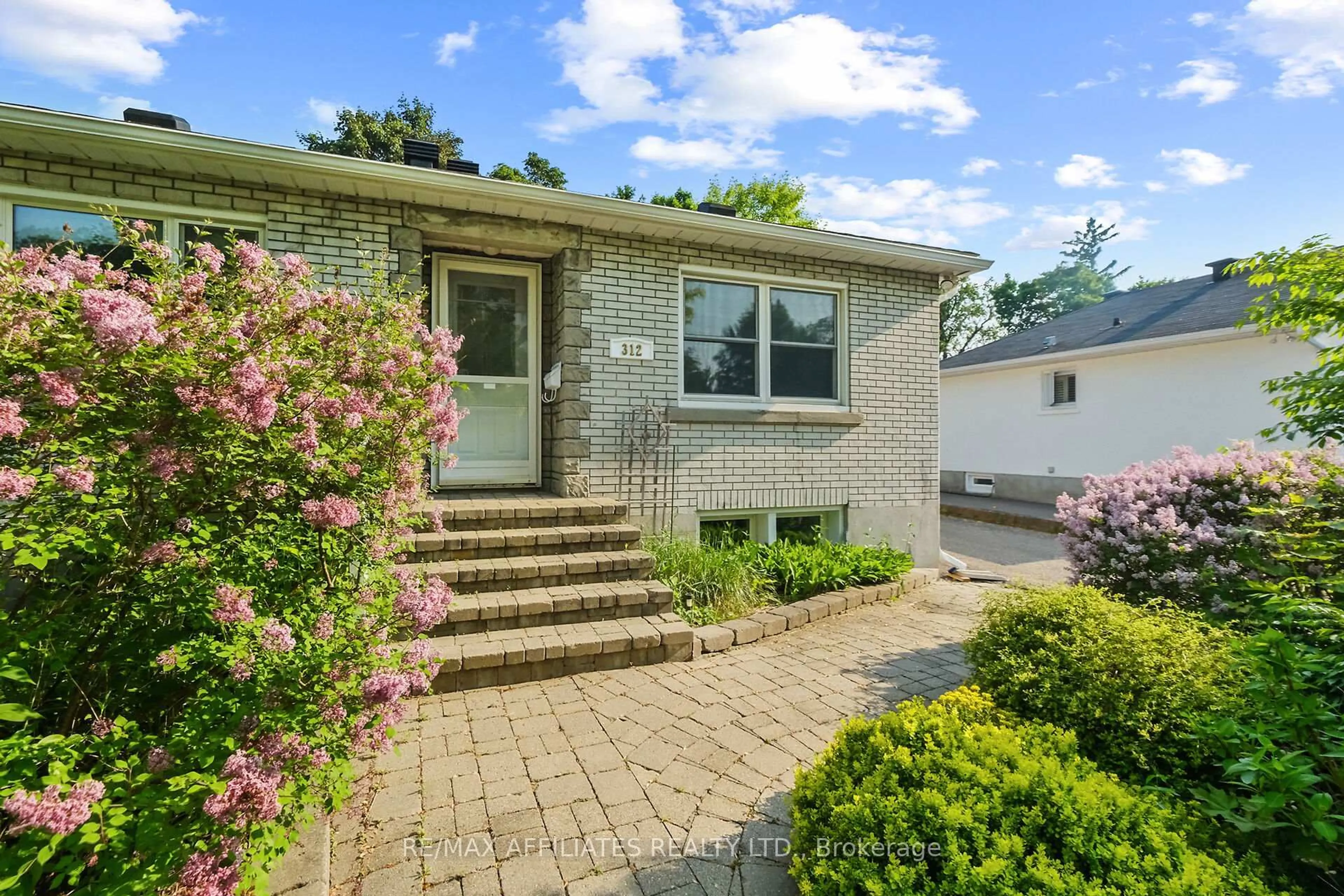 Home with brick exterior material, street for 312 Mountbatten Ave, Ottawa Ontario K1H 5W3