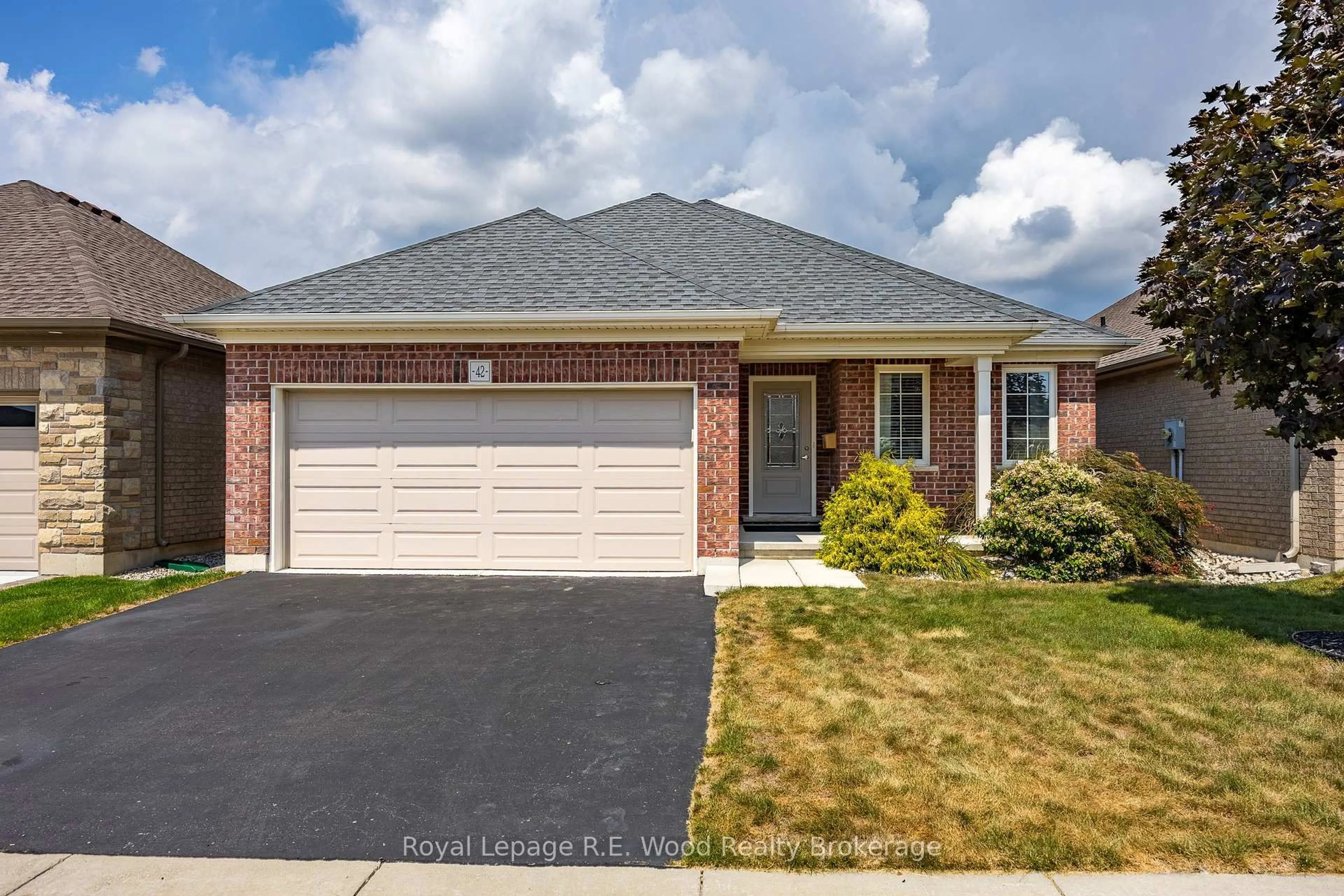 Home with brick exterior material, street for 42 Hogarth Dr, Tillsonburg Ontario N4G 0C3