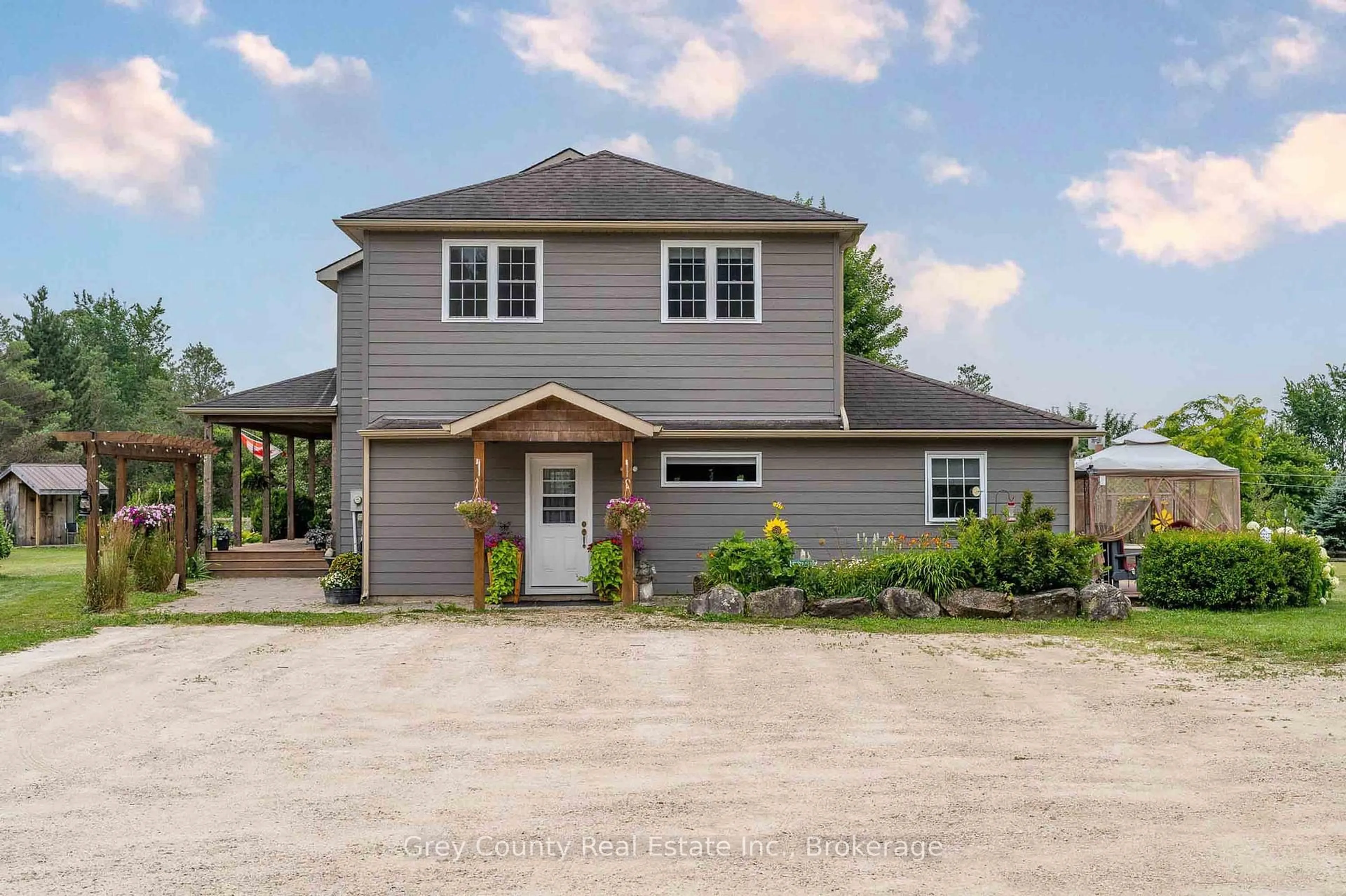 Home with vinyl exterior material, street for 135260 9th Line, Grey Highlands Ontario N0C 1H0