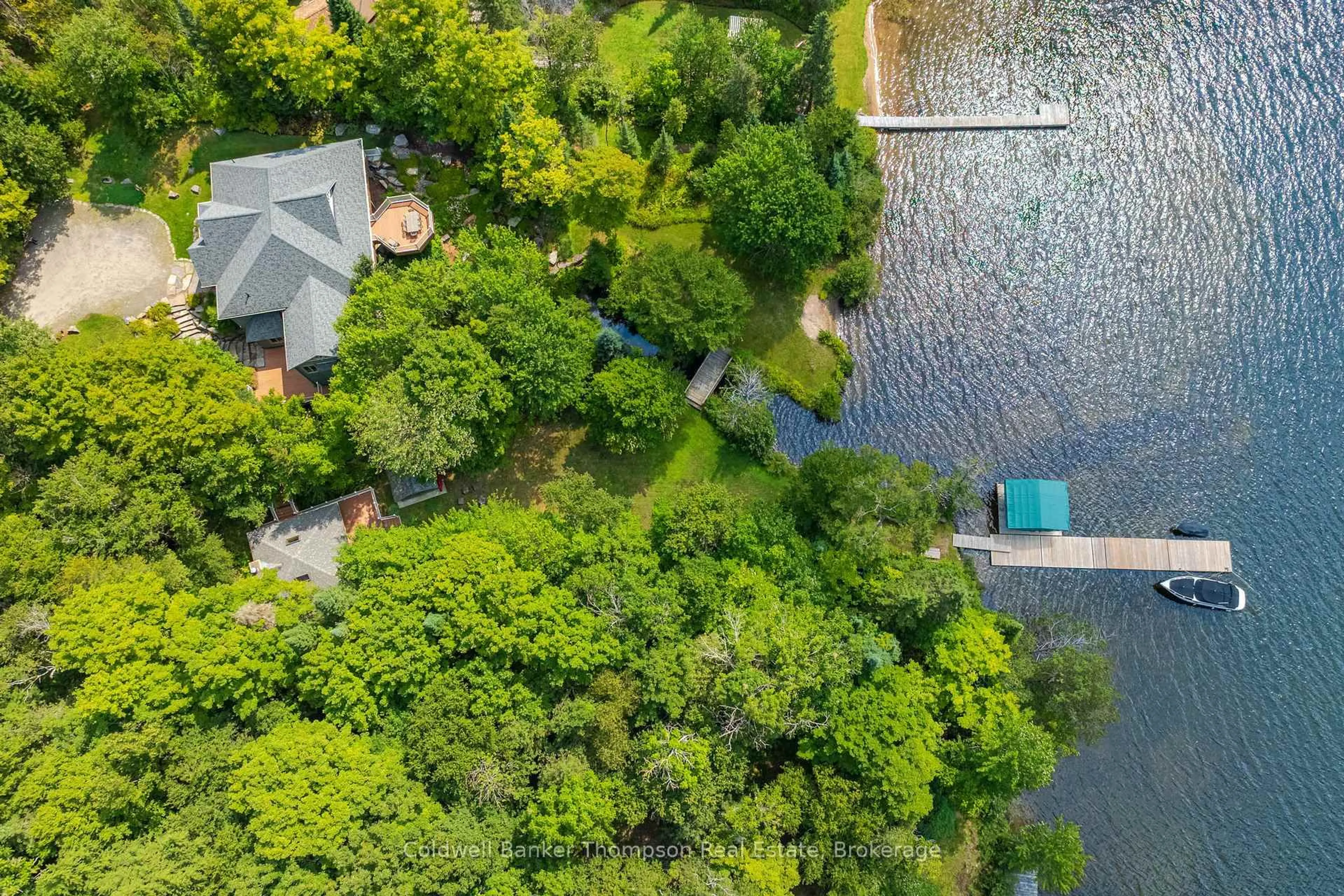 A pic from outside/outdoor area/front of a property/back of a property/a pic from drone, water/lake/river/ocean view for 2202 60 Highway, Lake of Bays Ontario P1H 2J6