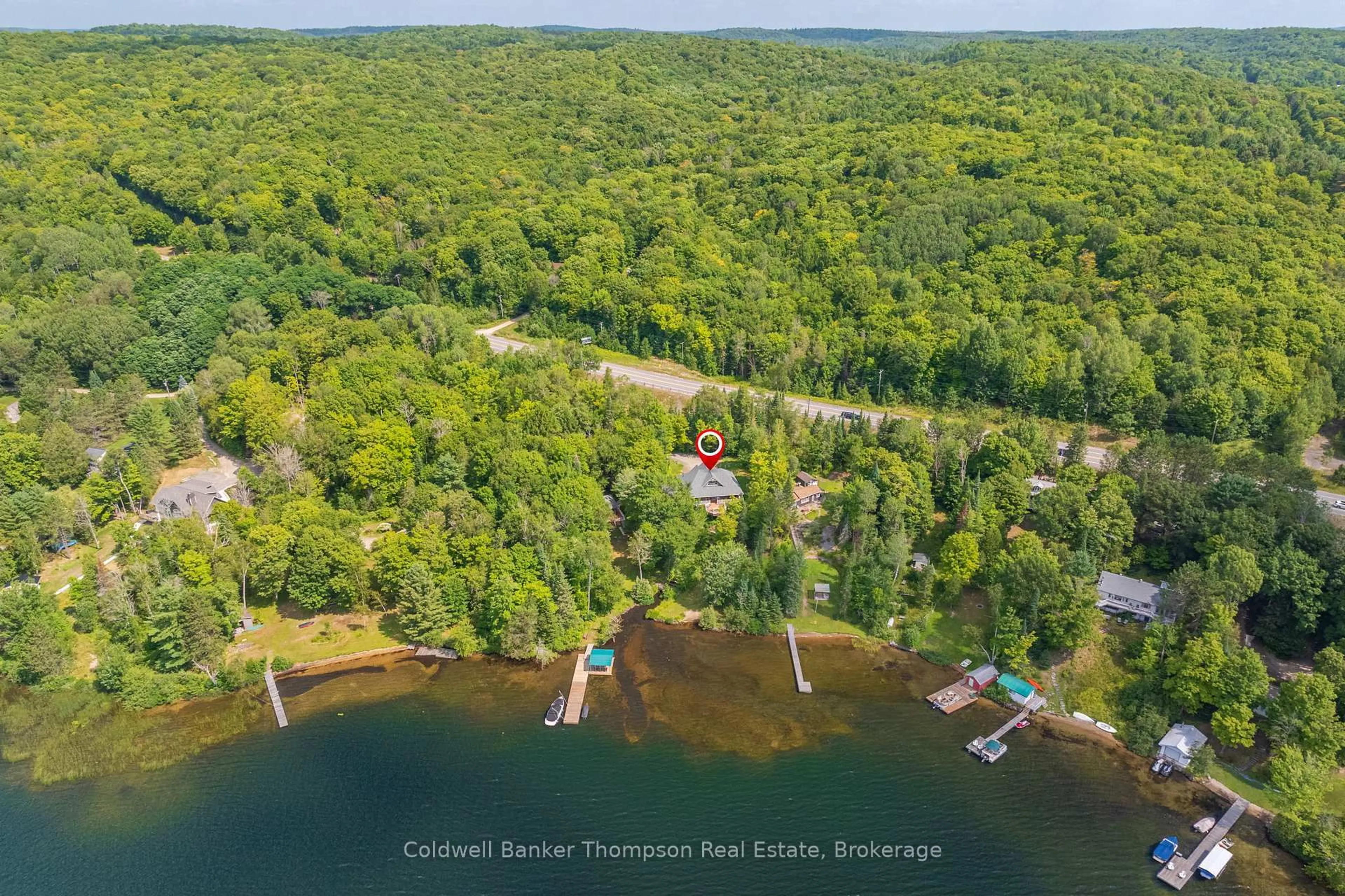 A pic from outside/outdoor area/front of a property/back of a property/a pic from drone, water/lake/river/ocean view for 2202 60 Highway, Lake of Bays Ontario P1H 2J6