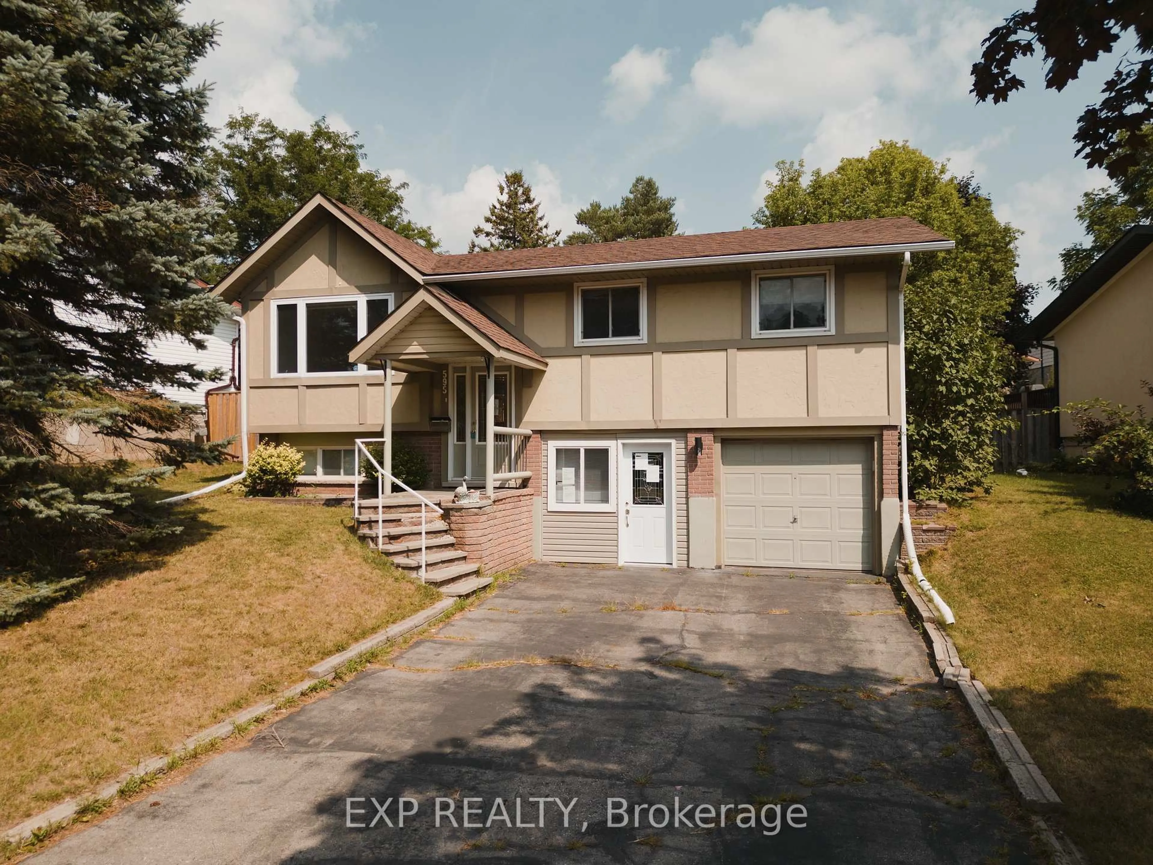 Home with vinyl exterior material, street for 595 Pioneer Dr, Kitchener Ontario N2P 1L6
