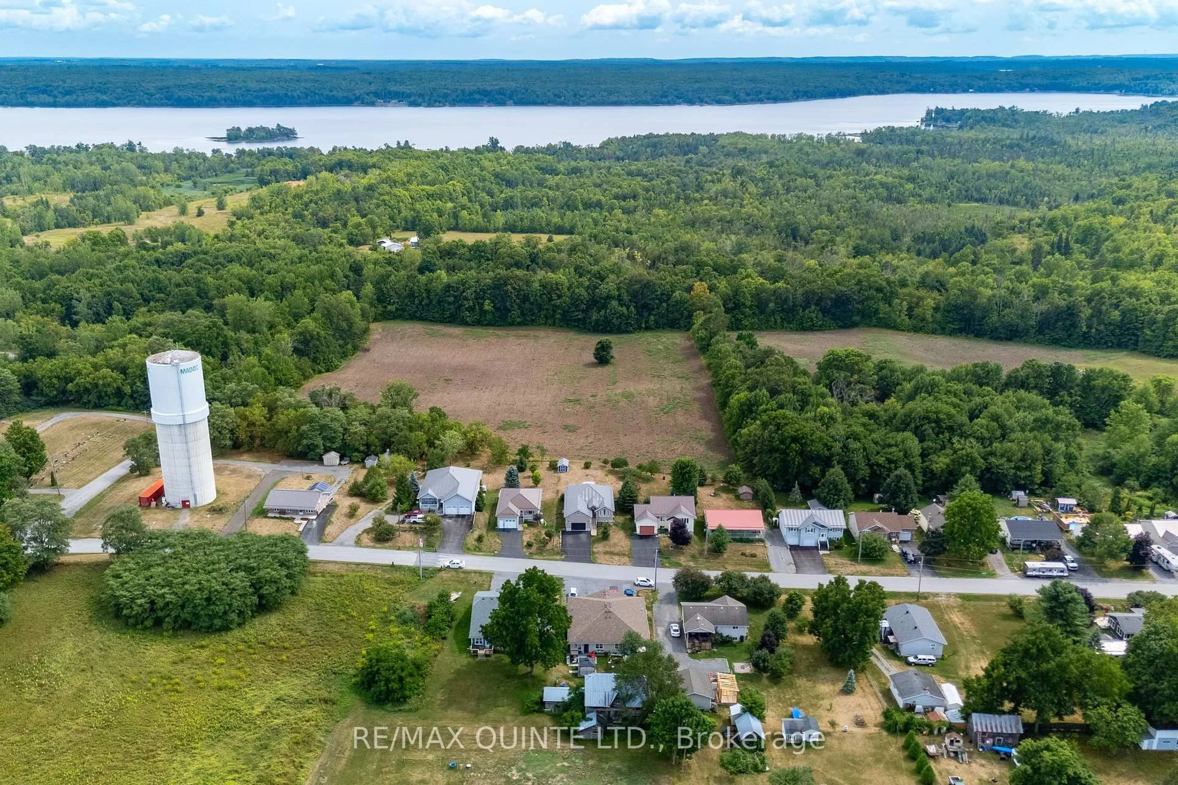 A pic from outside/outdoor area/front of a property/back of a property/a pic from drone, water/lake/river/ocean view for 99 Mckenzie St, Madoc Ontario K0K 2K0