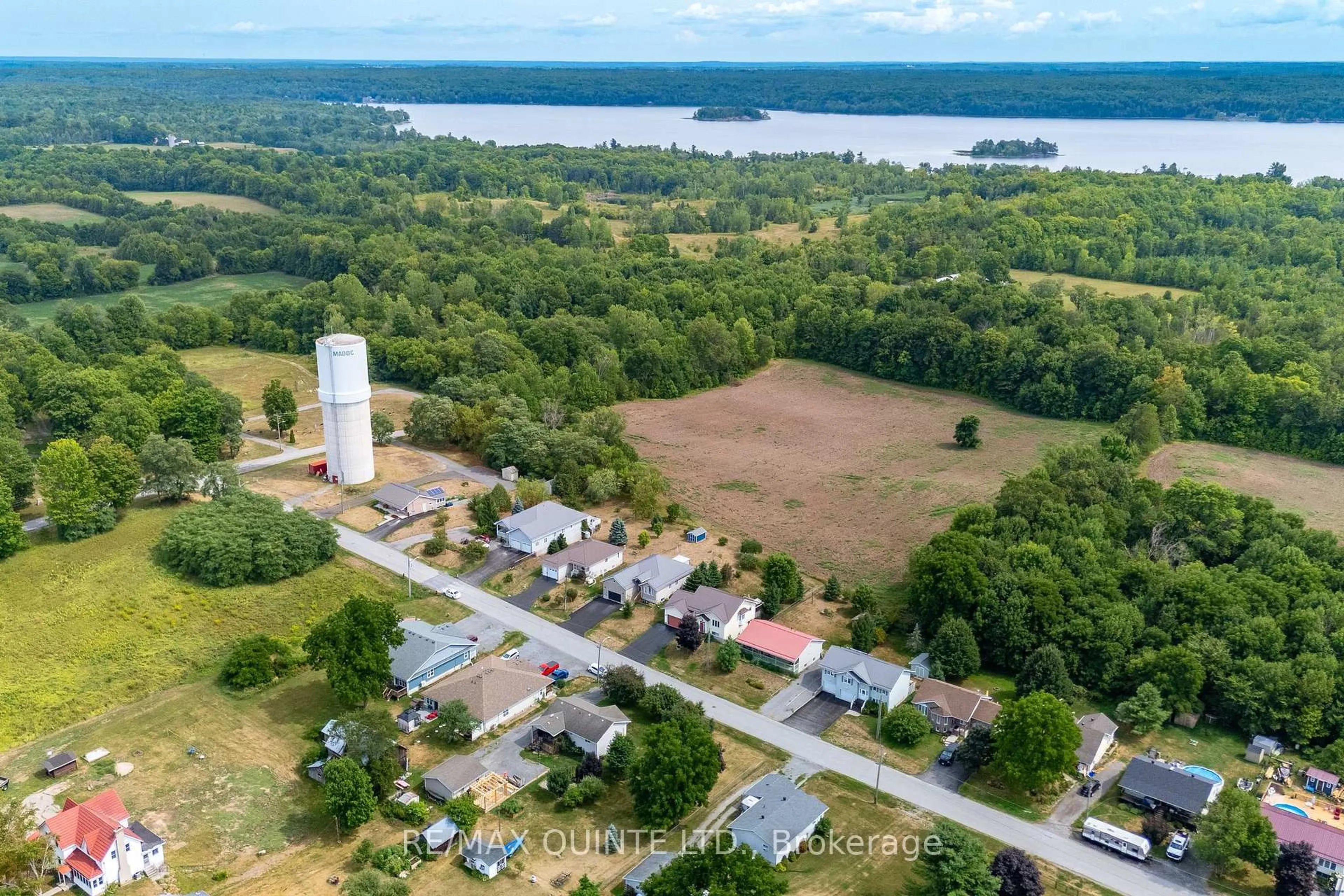 A pic from outside/outdoor area/front of a property/back of a property/a pic from drone, water/lake/river/ocean view for 99 Mckenzie St, Madoc Ontario K0K 2K0