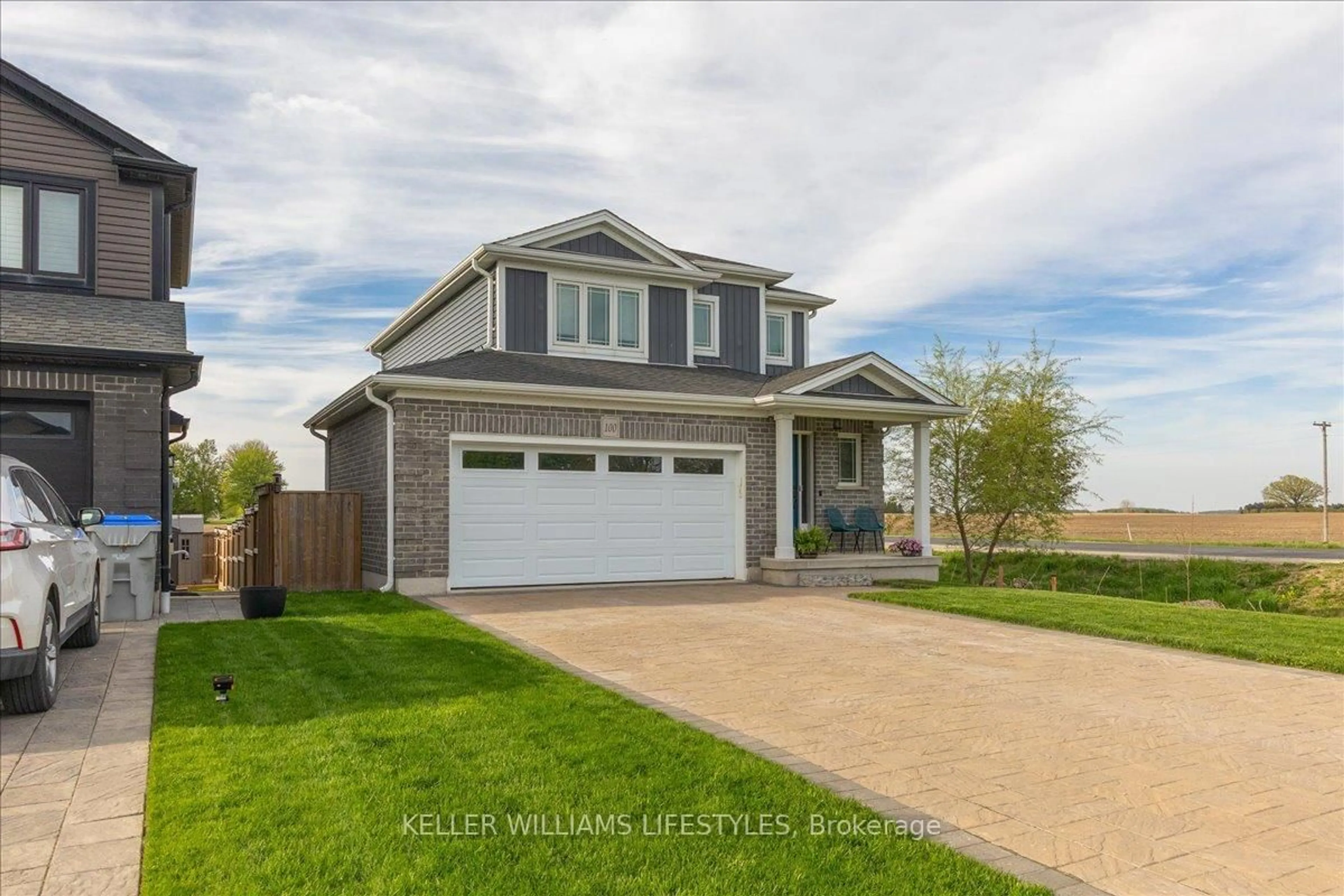 Home with vinyl exterior material, street for 100 GILMOUR Dr, Lucan Biddulph Ontario N0M 2J0