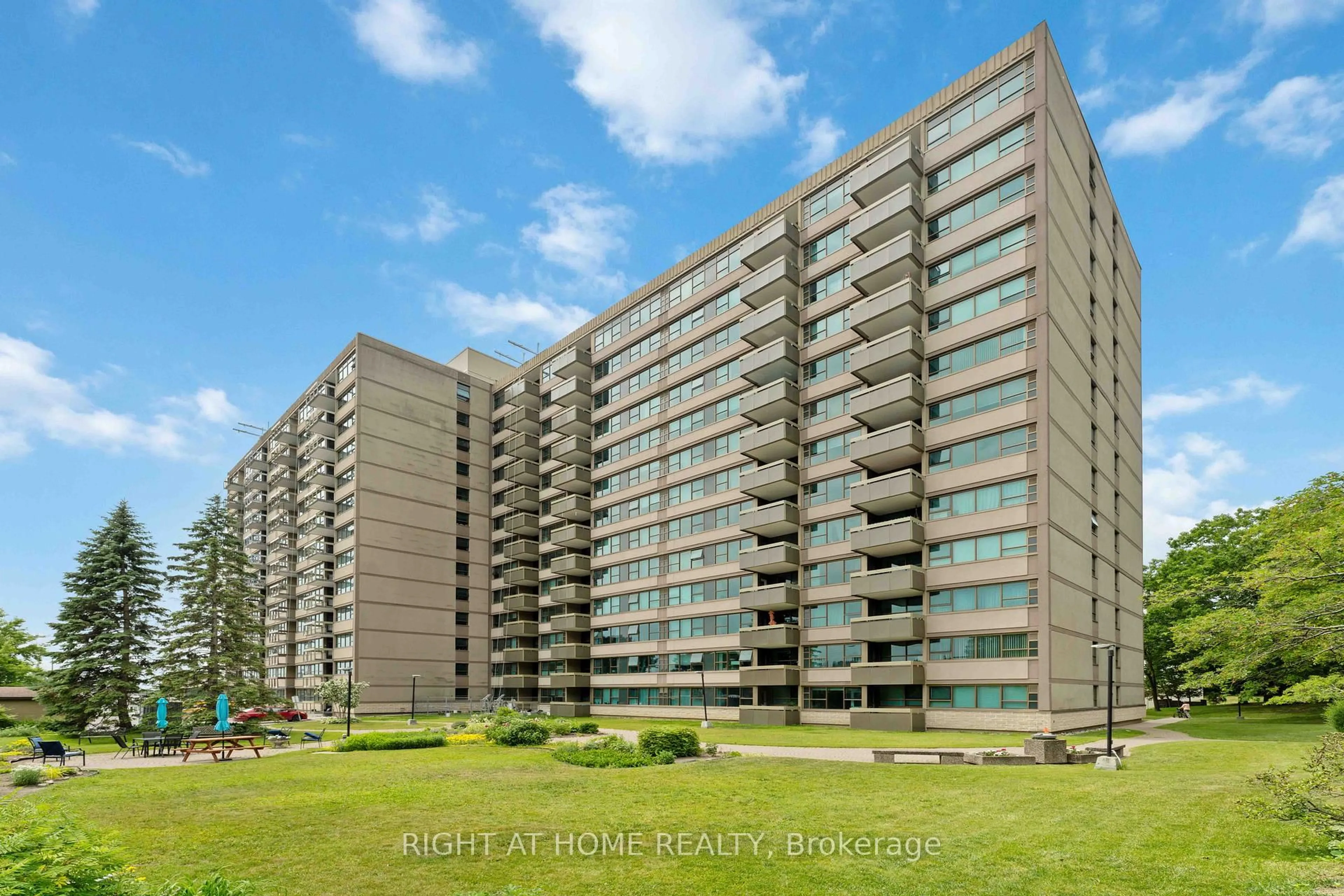 A pic from outside/outdoor area/front of a property/back of a property/a pic from drone, building for 555 Brittany Dr #302, Ottawa Ontario K1K 4C5