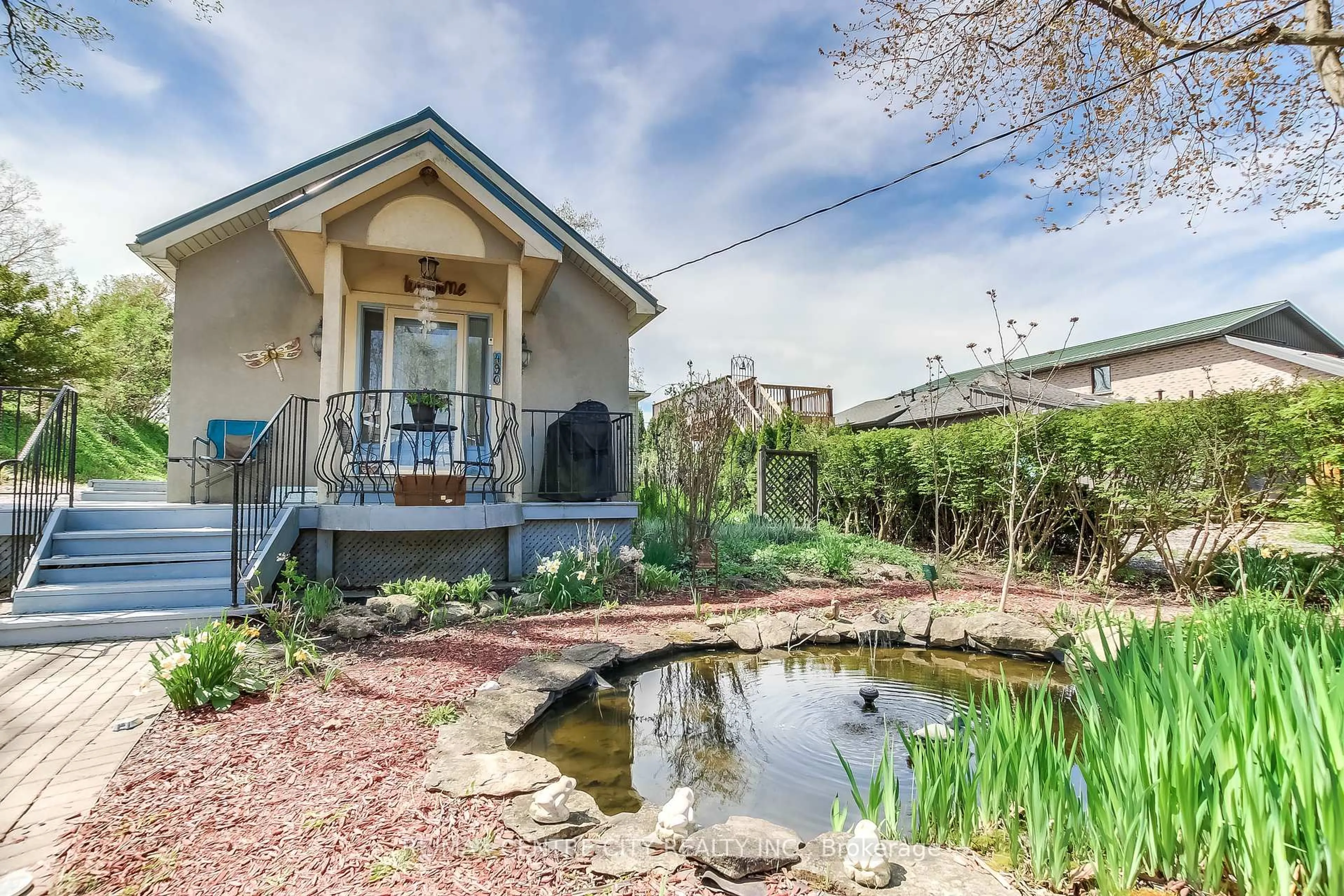 A pic from outside/outdoor area/front of a property/back of a property/a pic from drone, water/lake/river/ocean view for 490 LOWER SPRING St, Central Elgin Ontario N5L 1G6