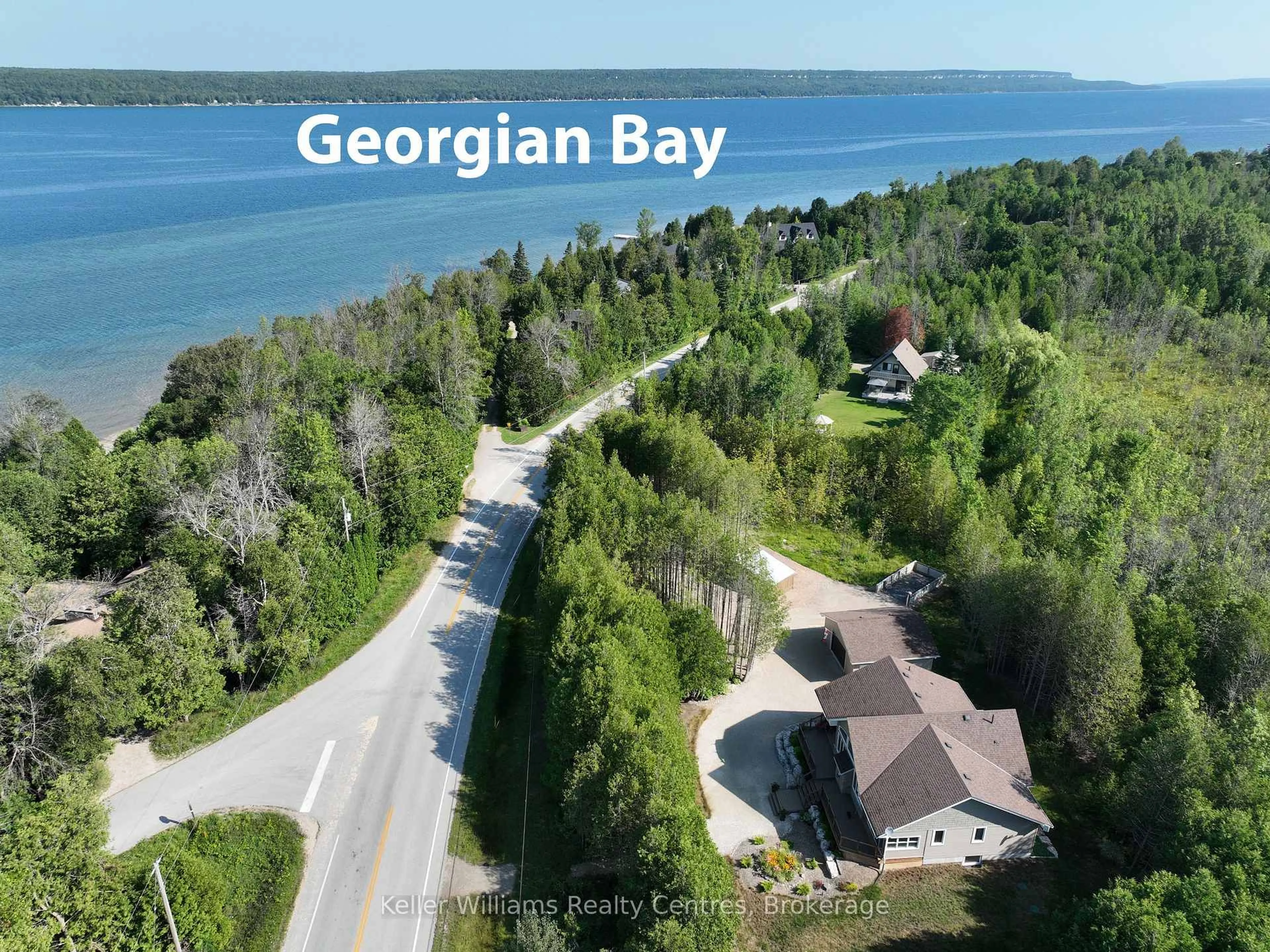A pic from outside/outdoor area/front of a property/back of a property/a pic from drone, water/lake/river/ocean view for 502180 Grey Road 1, Georgian Bluffs Ontario N0H 2T0