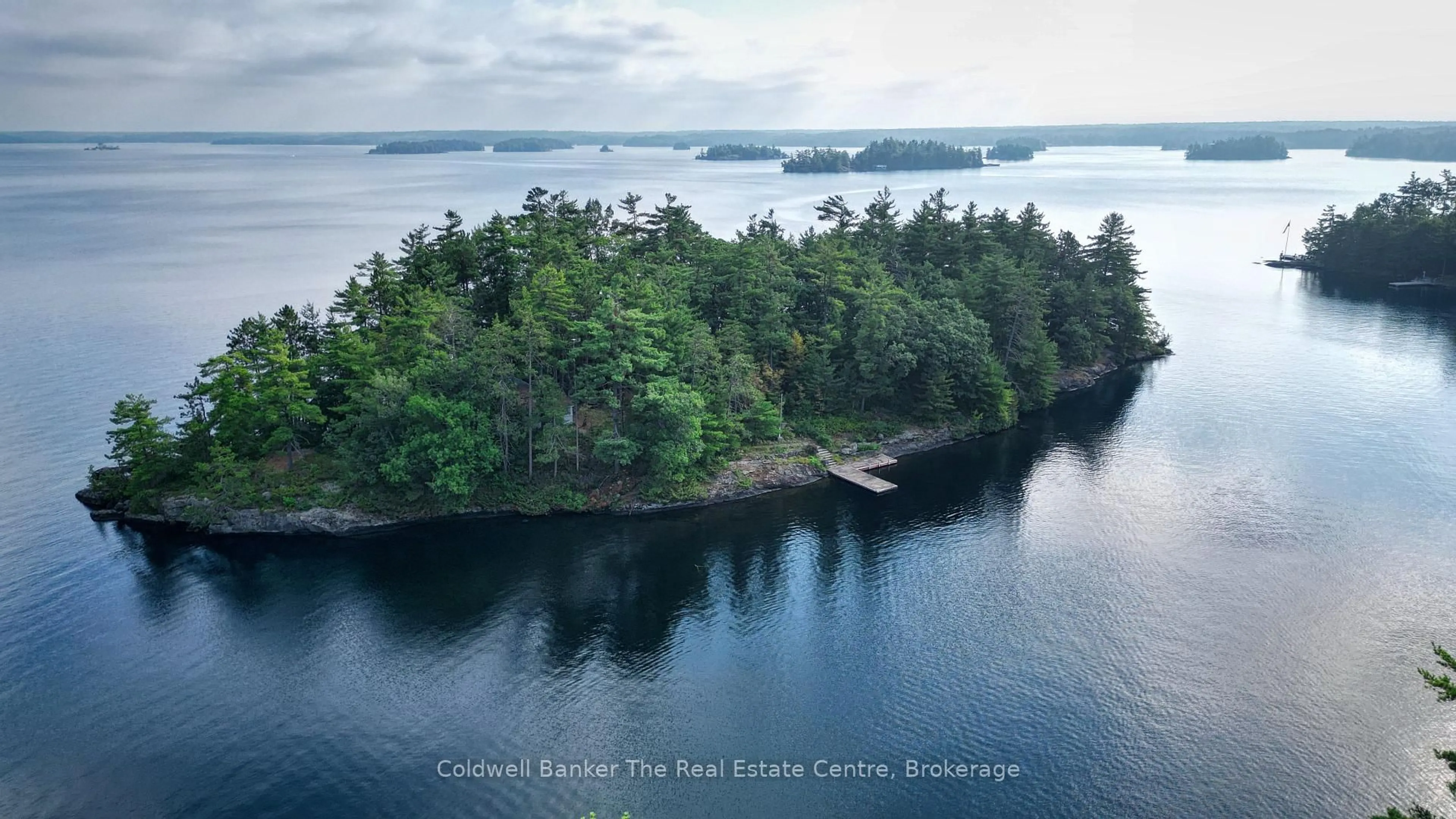 A pic from outside/outdoor area/front of a property/back of a property/a pic from drone, water/lake/river/ocean view for 1 Island 3LM Island, Gravenhurst Ontario P1P 1R2