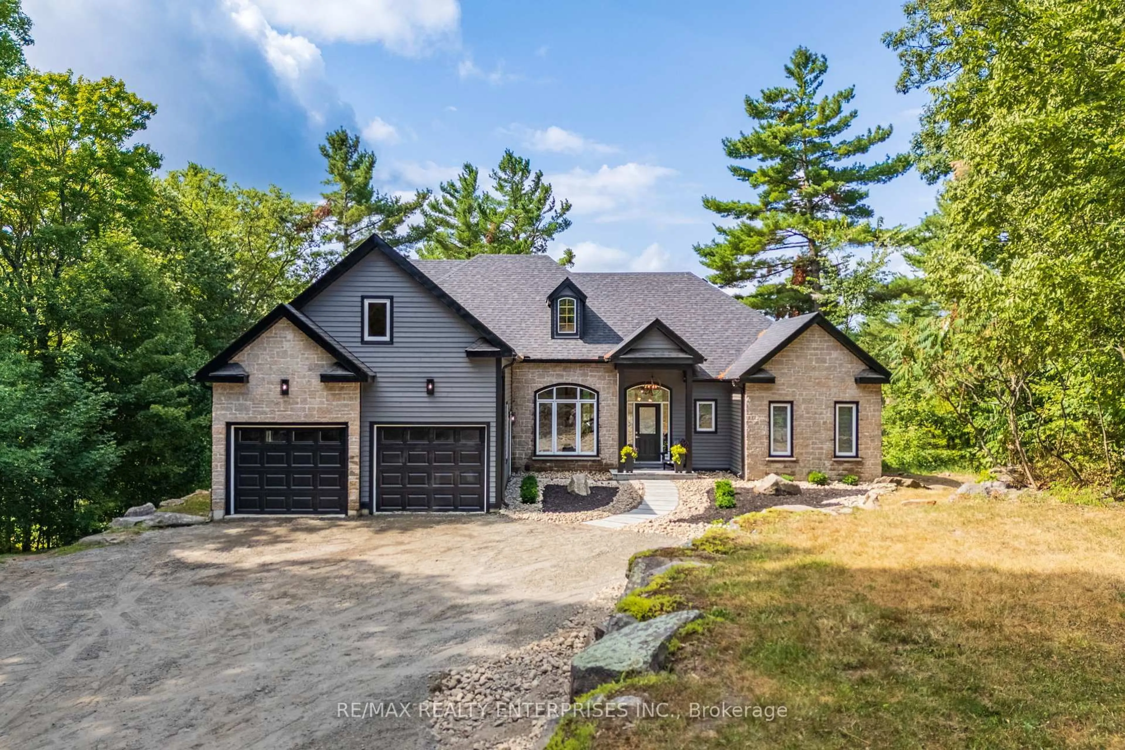 Home with brick exterior material, street for 49 Estates Dr, Muskoka Lakes Ontario P0B 1J0