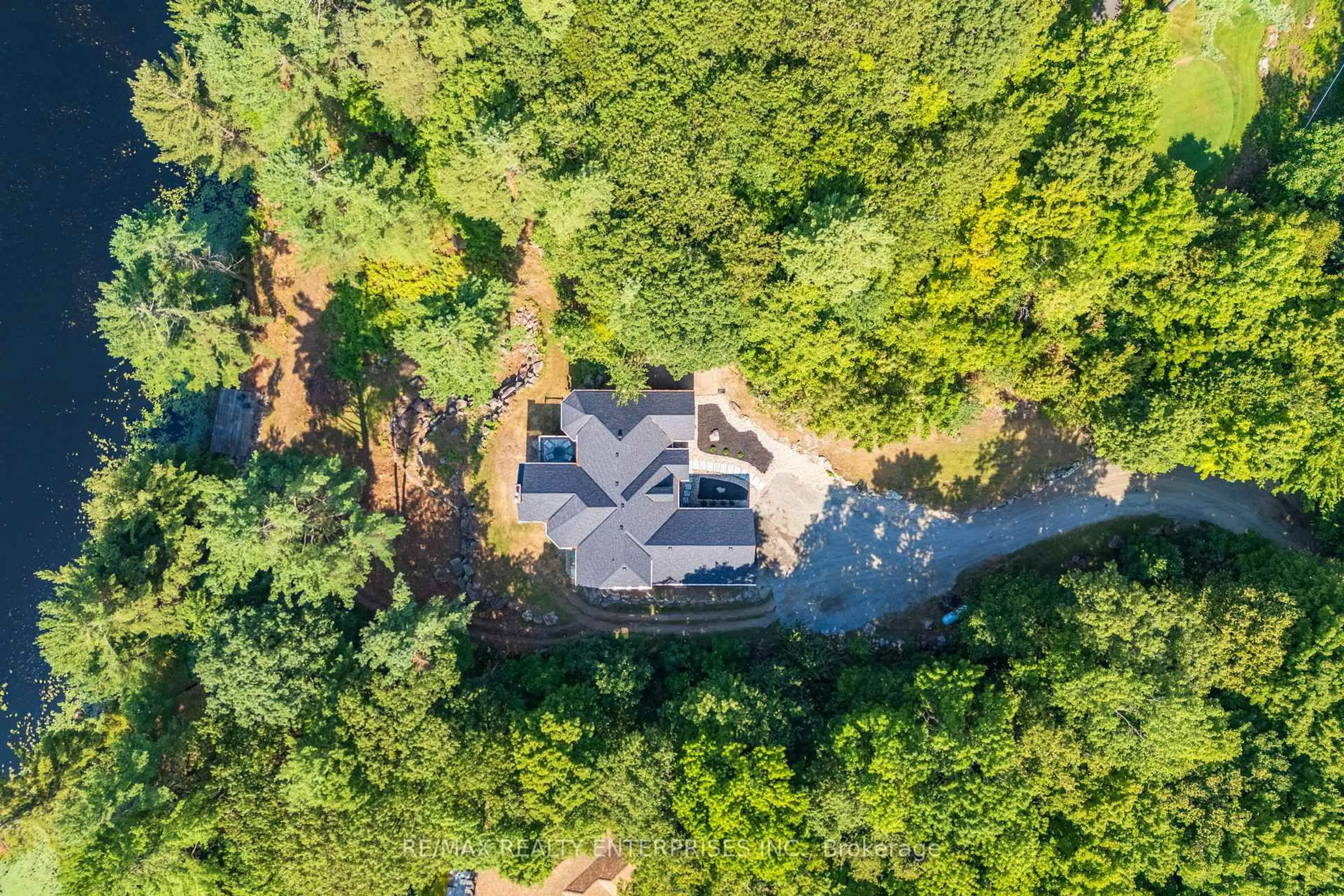 A pic from outside/outdoor area/front of a property/back of a property/a pic from drone, forest/trees view for 49 Estates Dr, Muskoka Lakes Ontario P0B 1J0