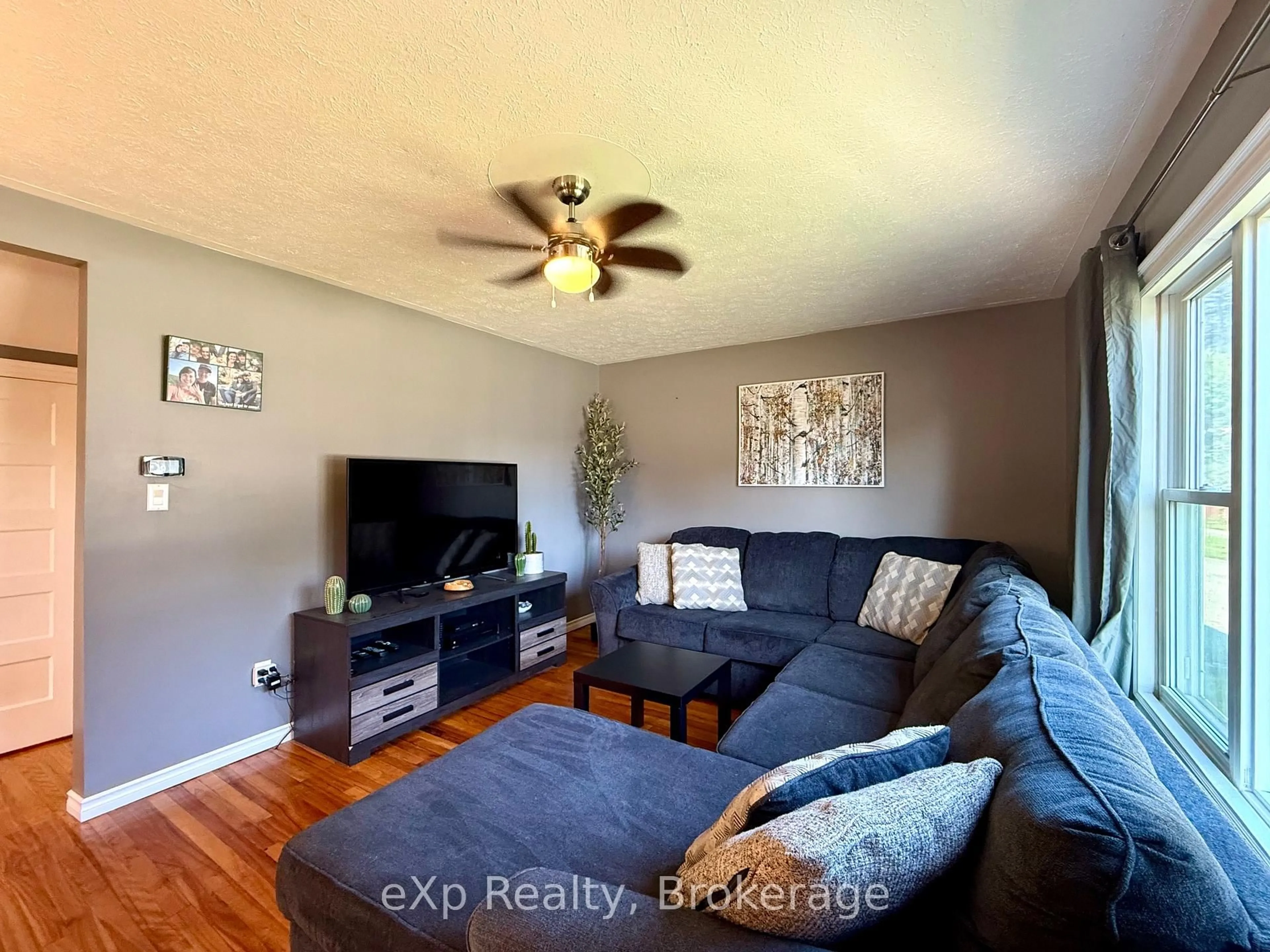 Living room with furniture, wood/laminate floor for 211 Elgin St, Brockton Ontario N0G 2V0