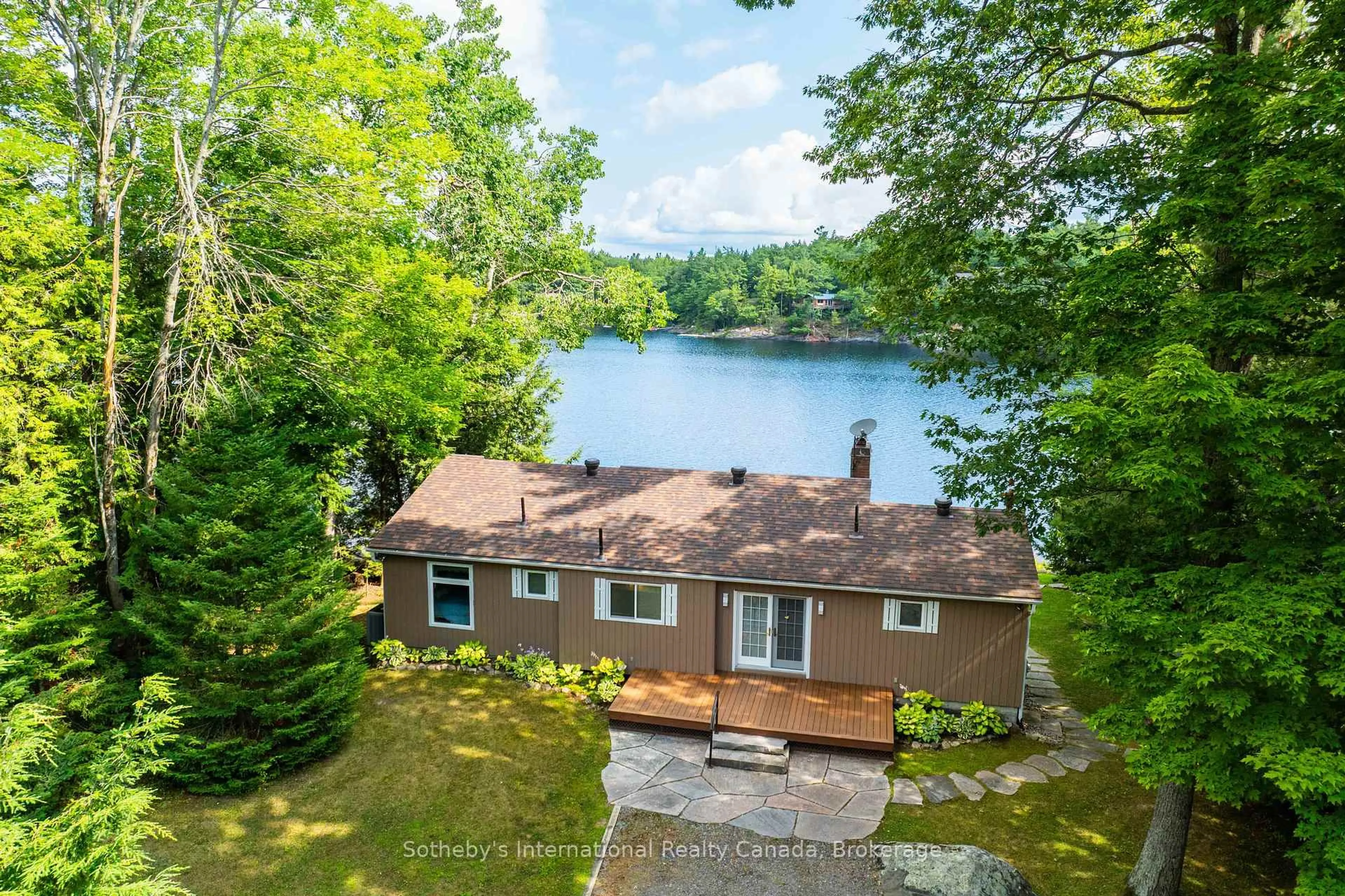 A pic from outside/outdoor area/front of a property/back of a property/a pic from drone, water/lake/river/ocean view for 1097 Hurling Point Rd, Muskoka Lakes Ontario P0C 1A0