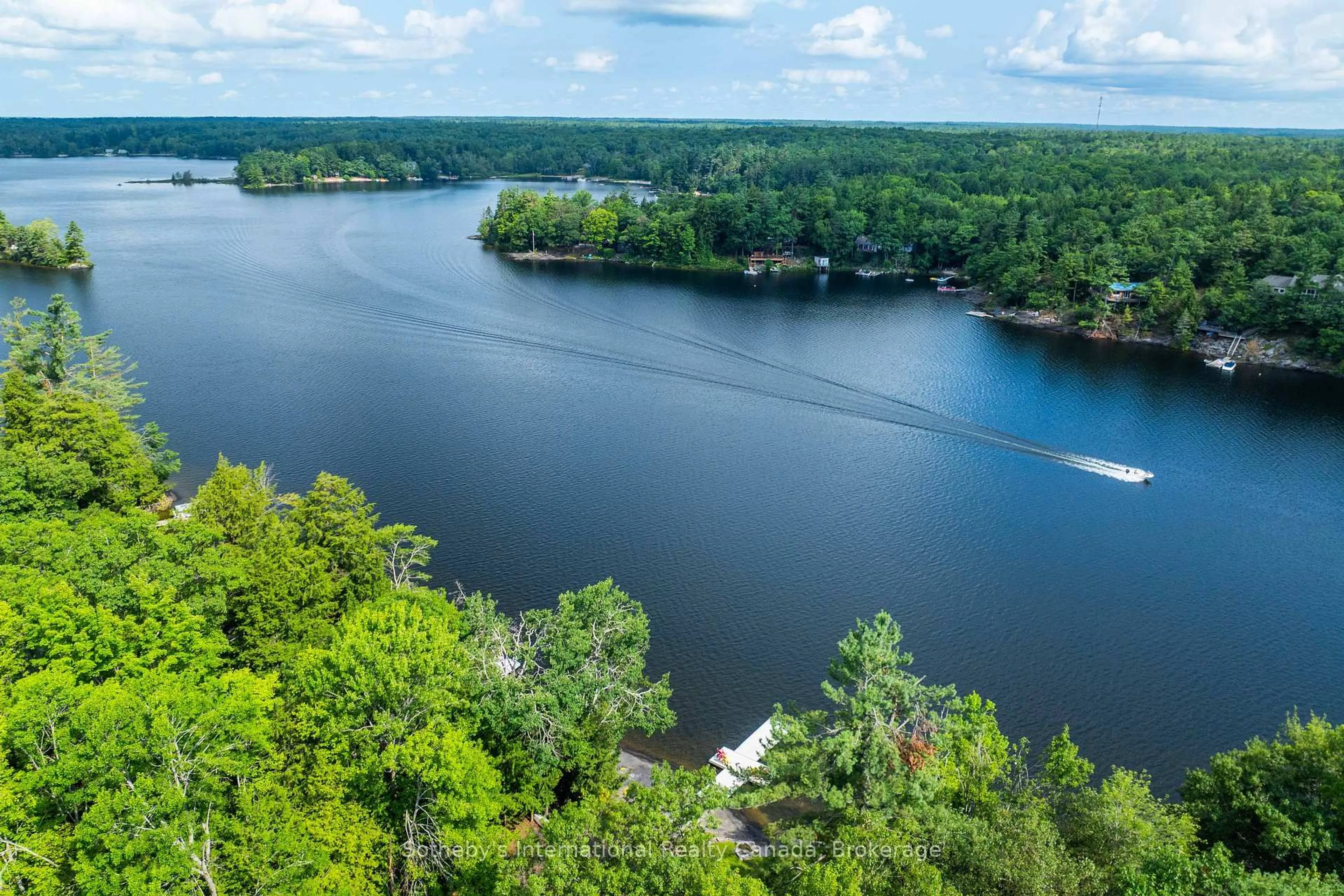 A pic from outside/outdoor area/front of a property/back of a property/a pic from drone, water/lake/river/ocean view for 1097 Hurling Point Rd, Muskoka Lakes Ontario P0C 1A0