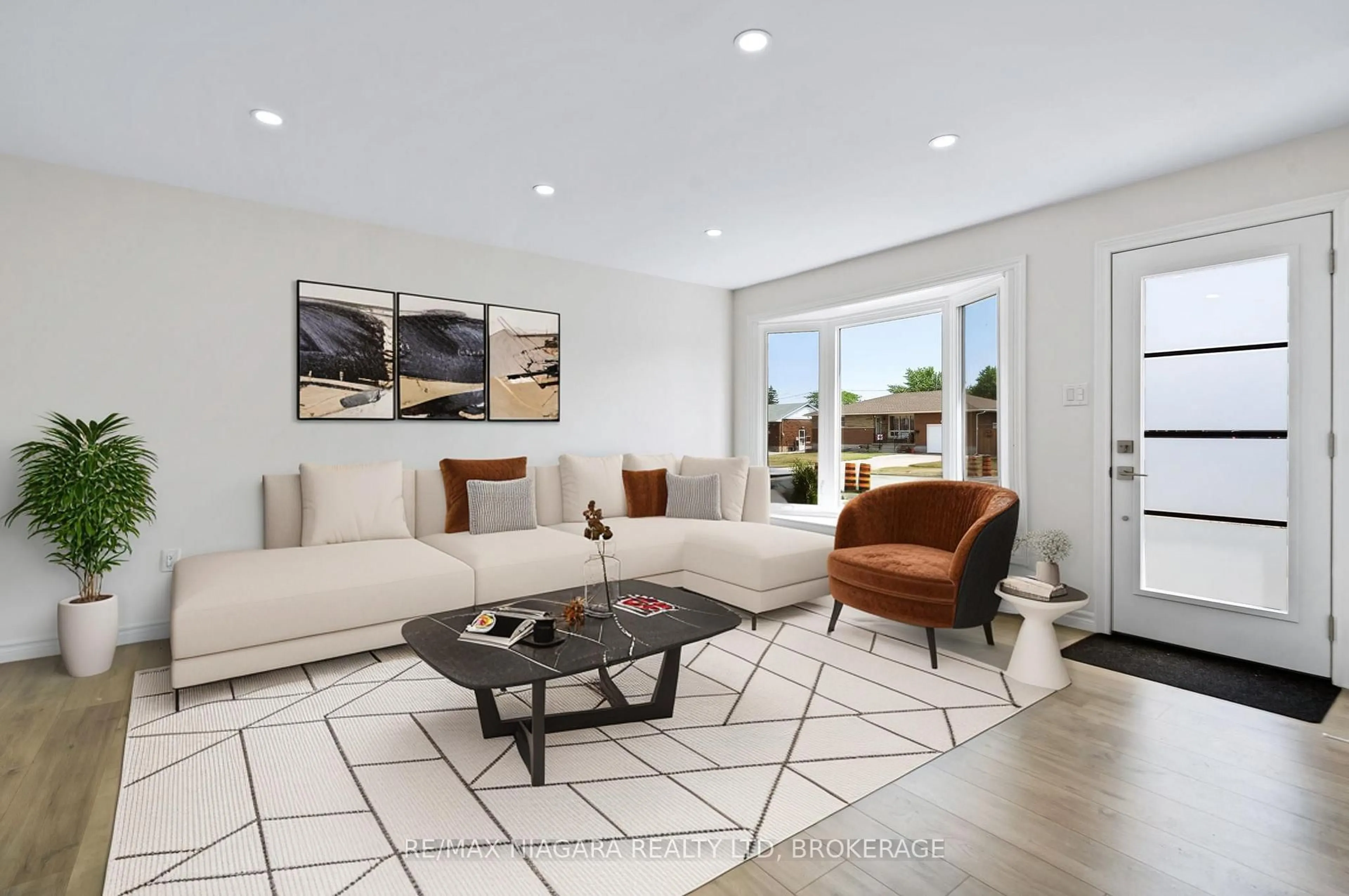 Living room with furniture, ceramic/tile floor for 53 Collier Rd, Thorold Ontario L2V 3S9