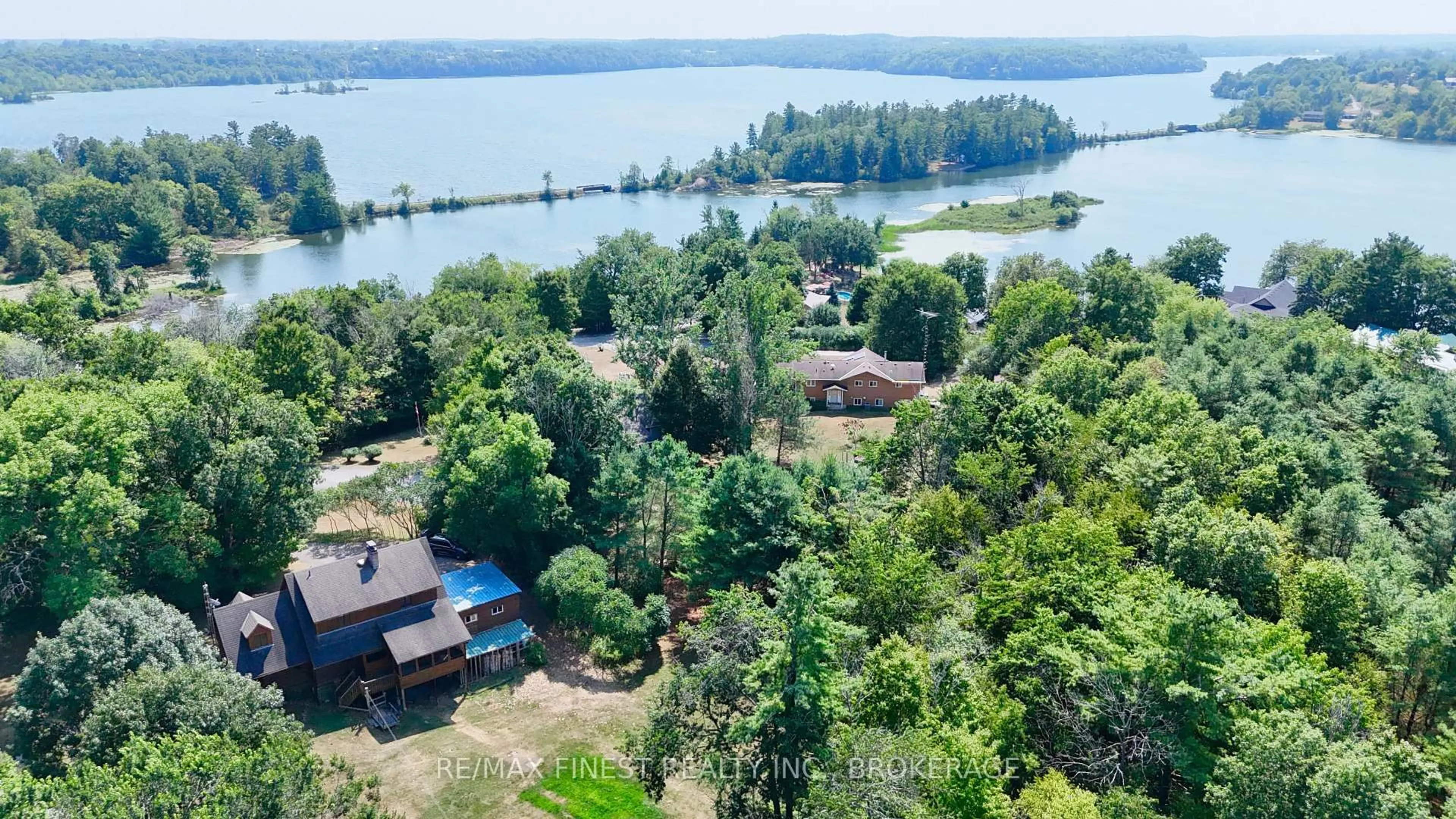 A pic from outside/outdoor area/front of a property/back of a property/a pic from drone, water/lake/river/ocean view for 1132 Leach Lane, Sydenham Ontario K0H 2T0