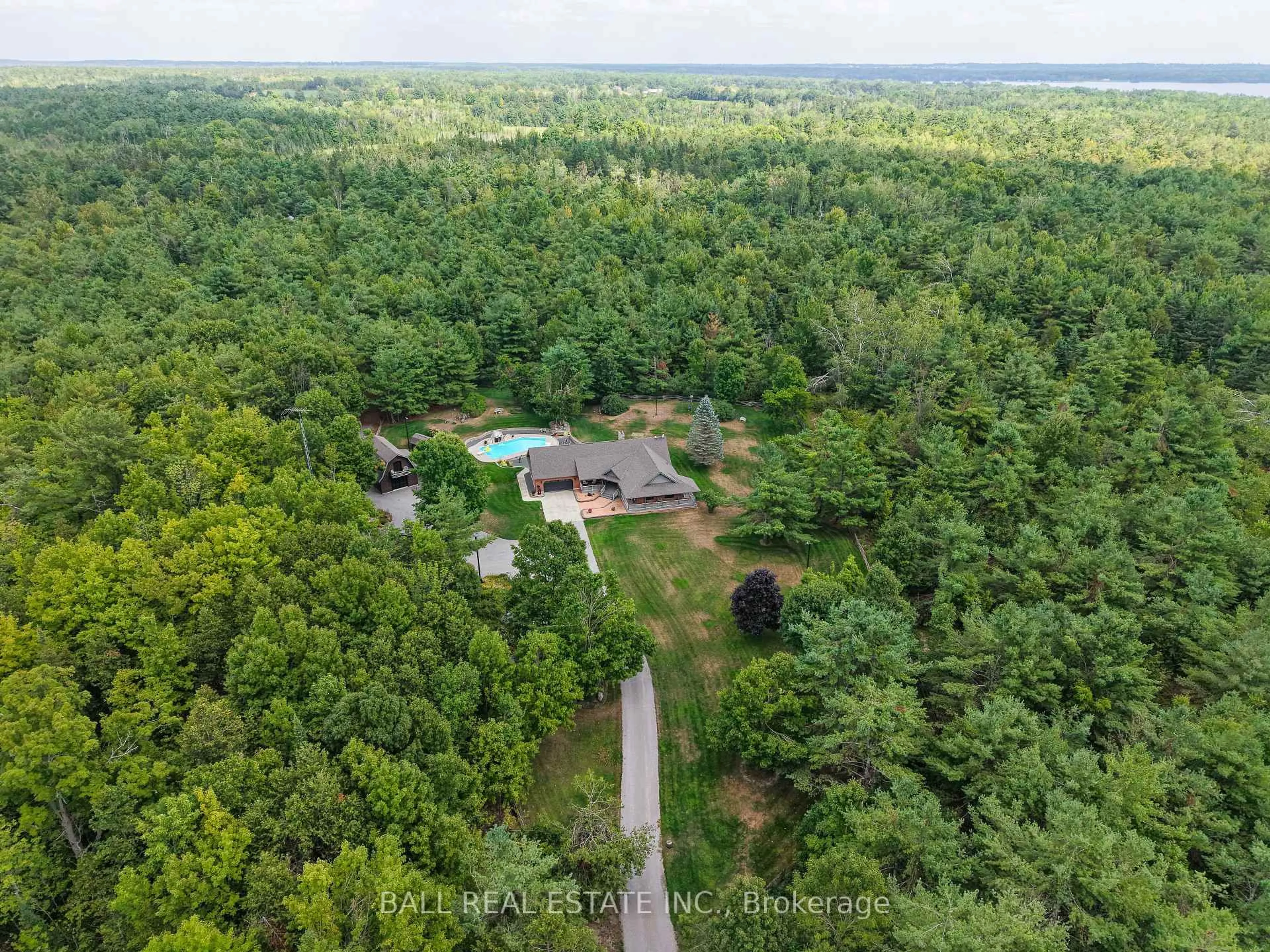 A pic from outside/outdoor area/front of a property/back of a property/a pic from drone, forest/trees view for 110 Grantsville Tr, Trent Lakes Ontario K0L 1J0