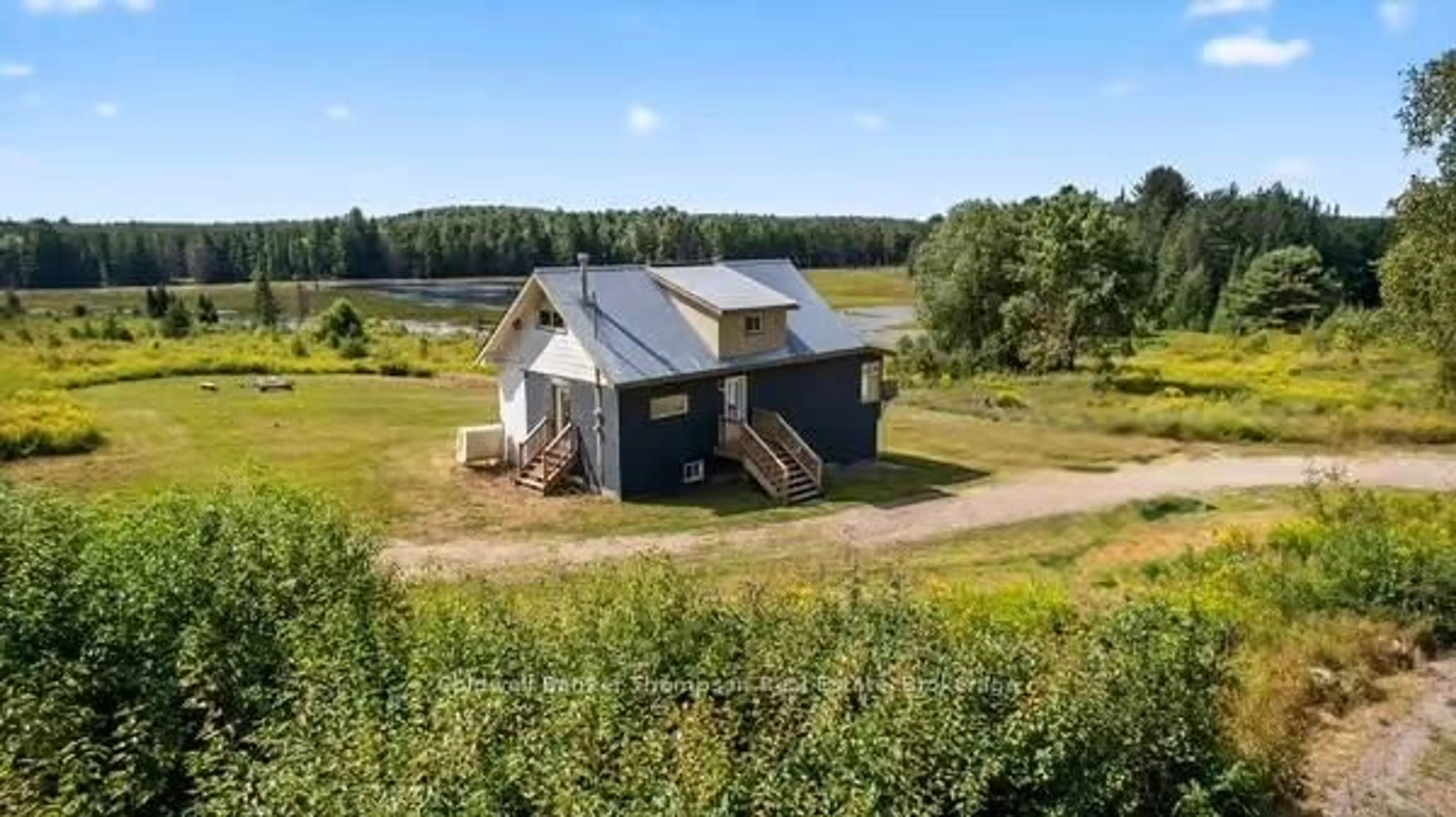 A pic from outside/outdoor area/front of a property/back of a property/a pic from drone, unknown for 193 Yearly Community Centre Rd, Huntsville Ontario P0B 1M0