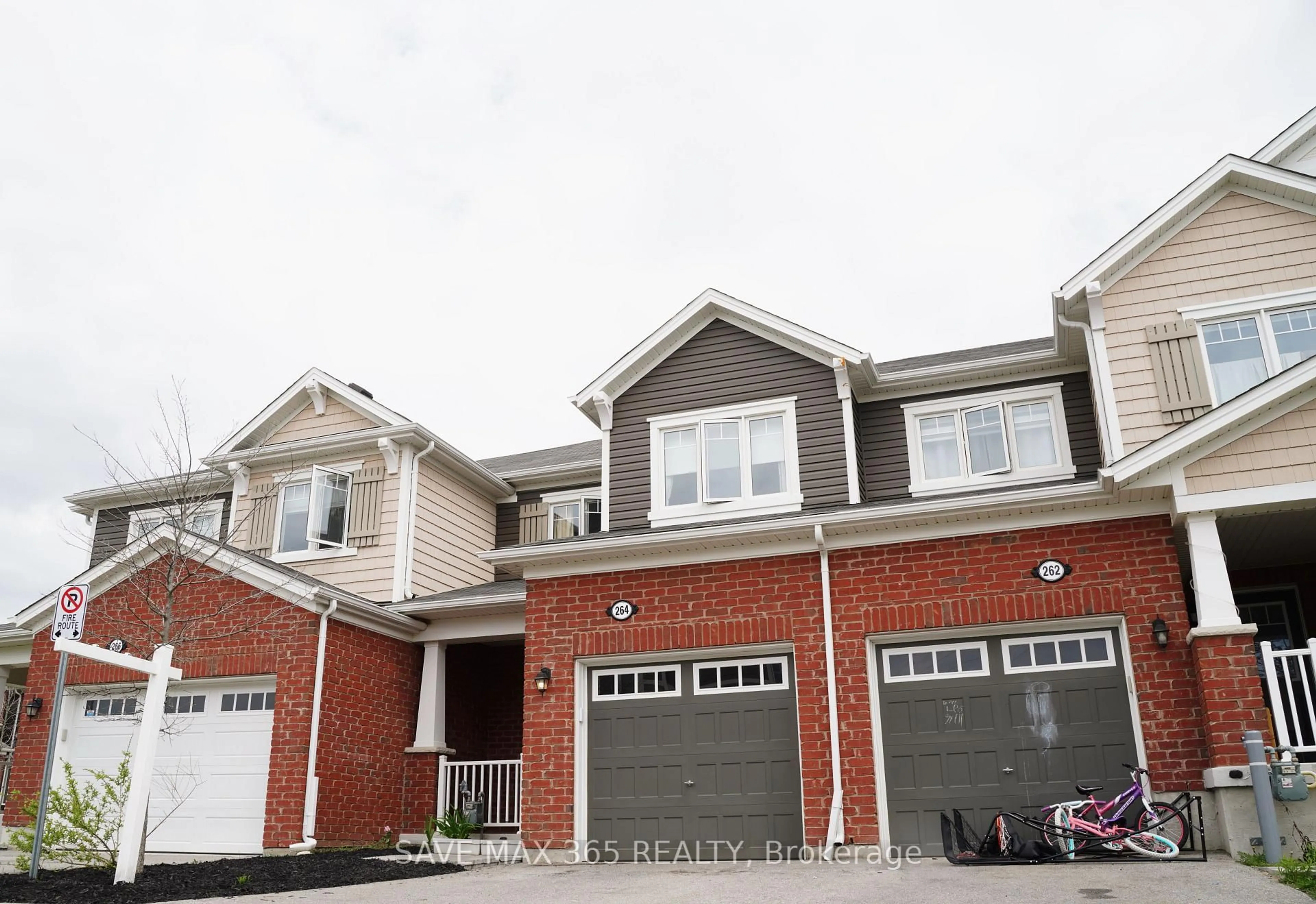 Home with brick exterior material, street for 264 Waterbrook Lane, Kitchener Ontario N2P 0H7