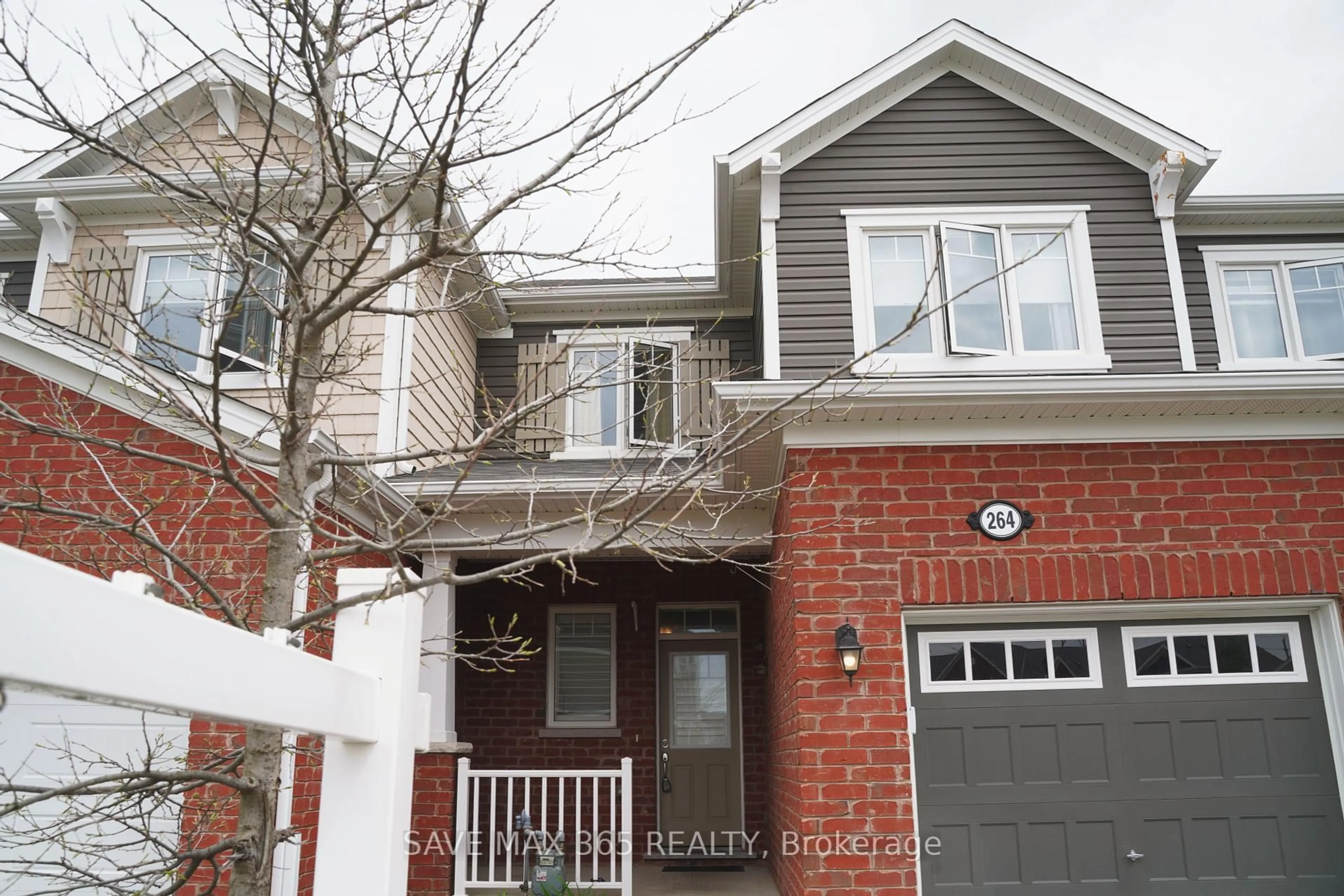 Home with brick exterior material, street for 264 Waterbrook Lane, Kitchener Ontario N2P 0H7