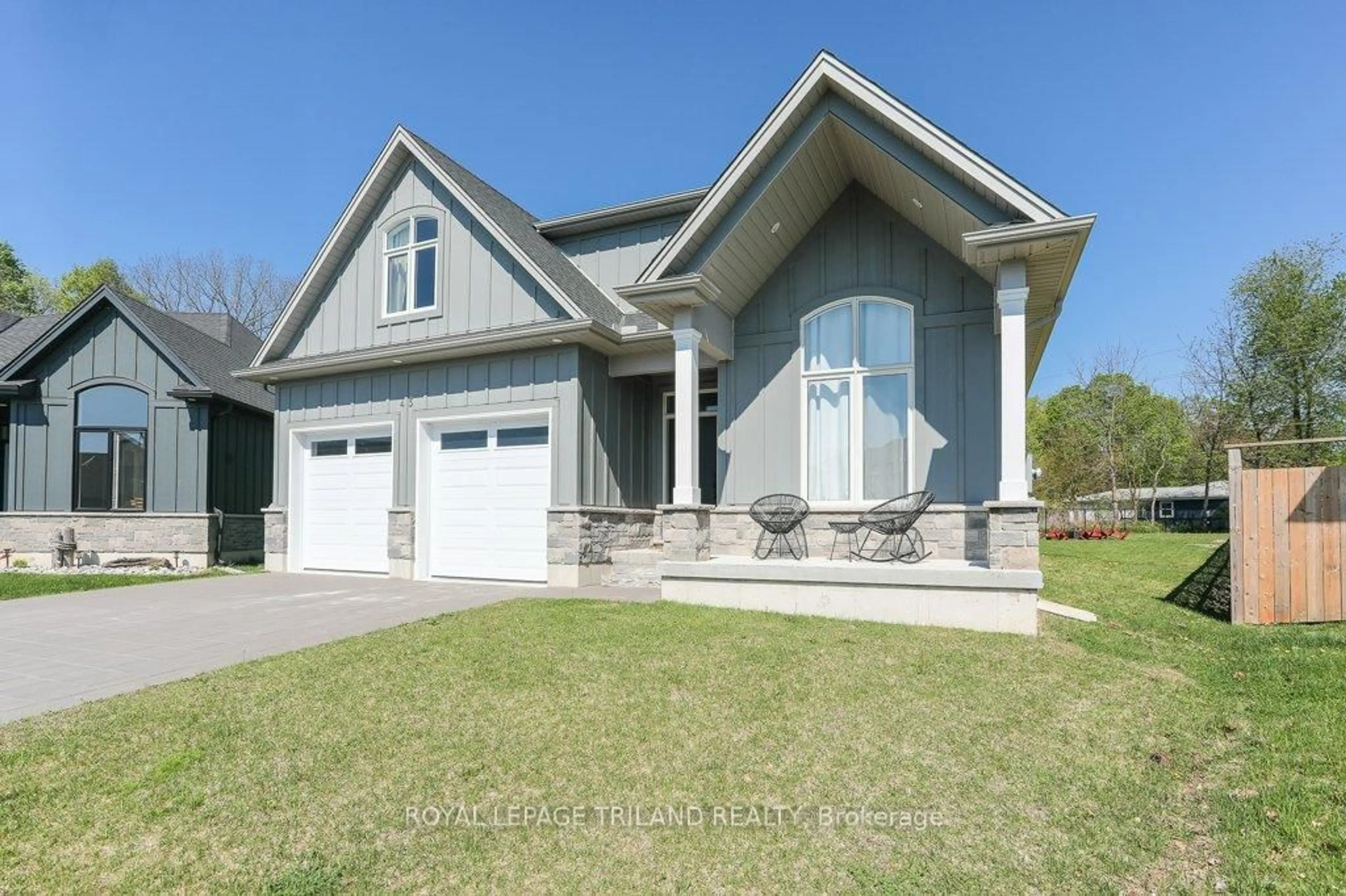 Home with vinyl exterior material, street for 45 Compass Tr, Central Elgin Ontario N5L 0B4