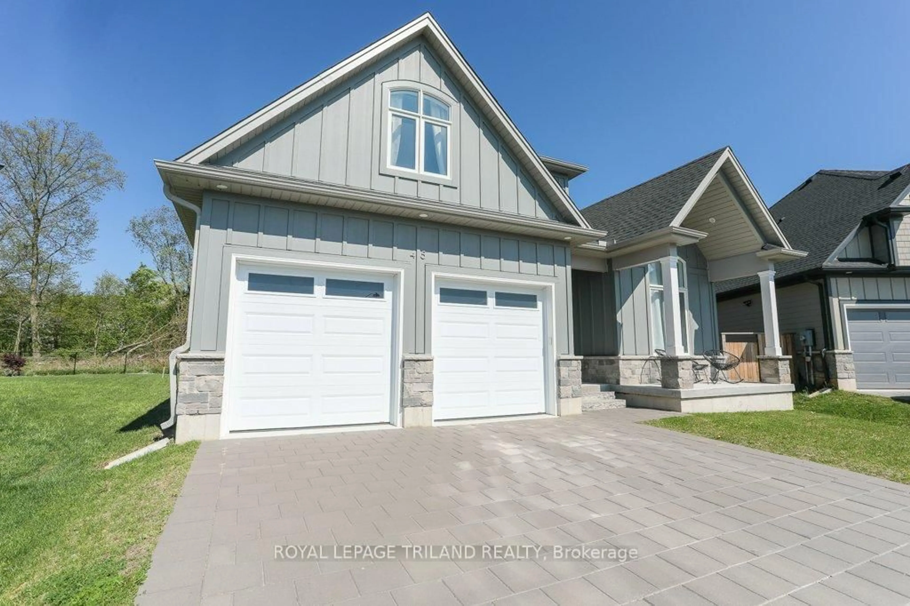 Home with vinyl exterior material, street for 45 Compass Tr, Central Elgin Ontario N5L 0B4