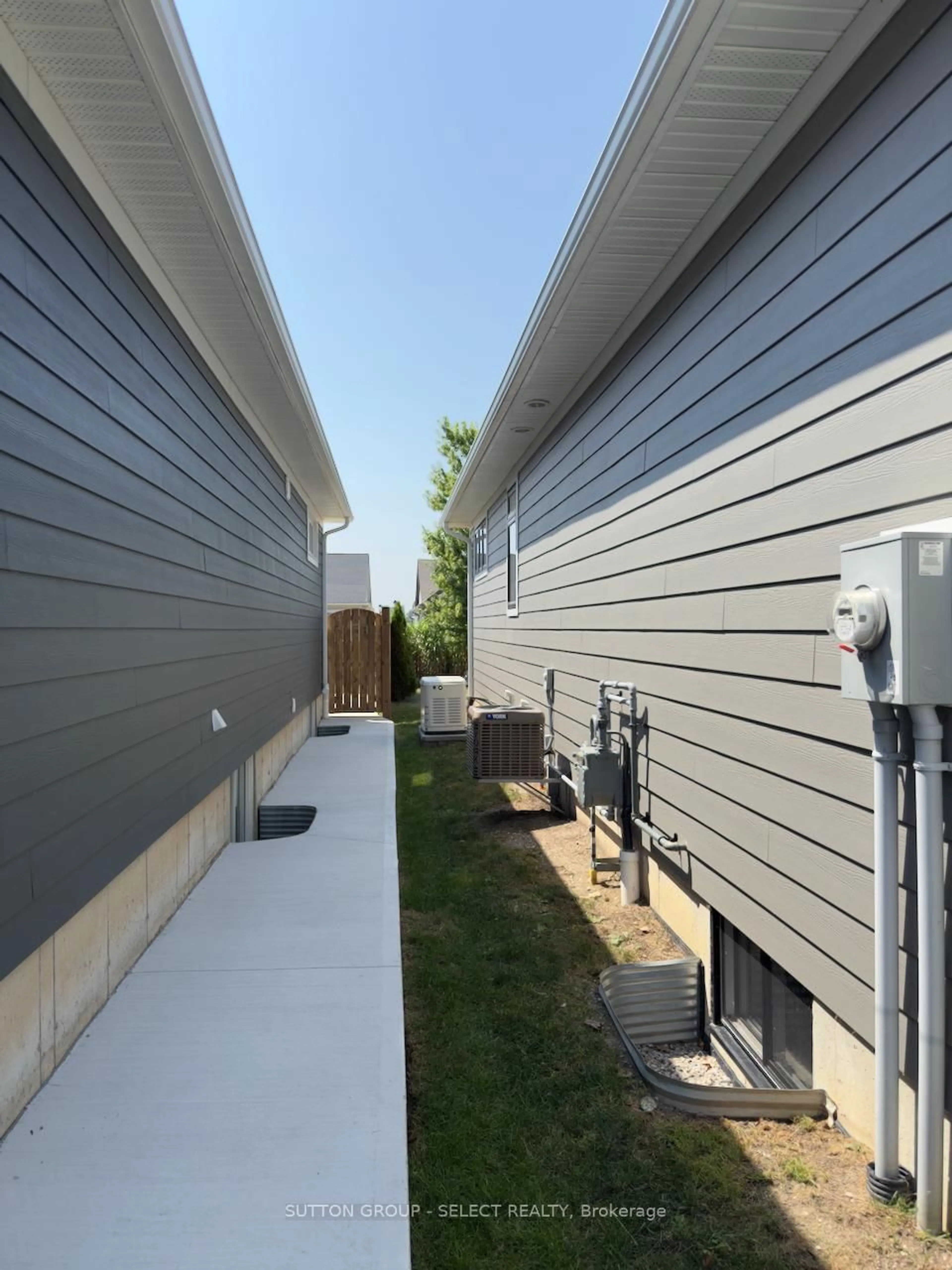 Home with vinyl exterior material, street for 58 DEERFIELD Rd, Lambton Shores Ontario N0M 1T0