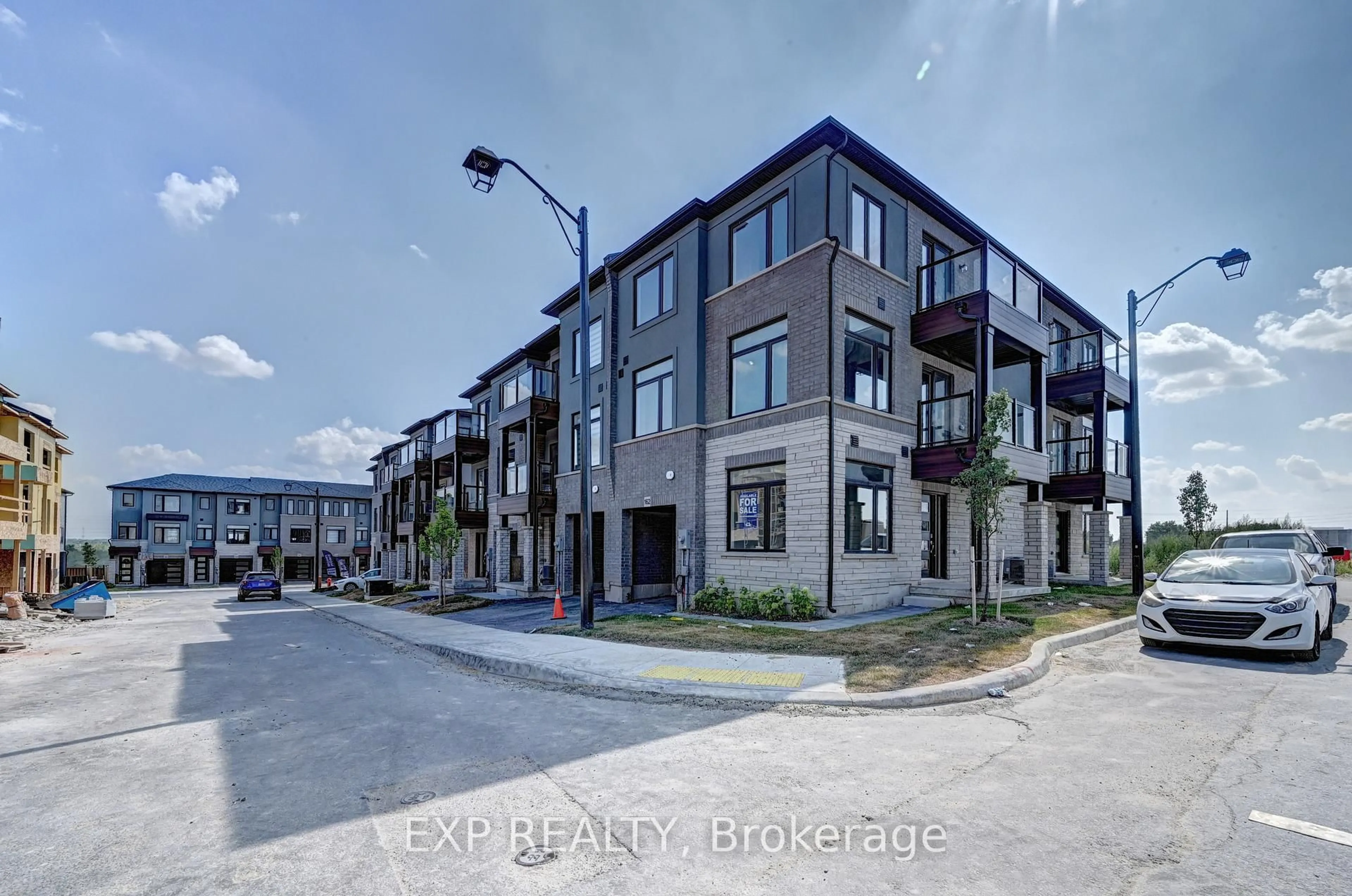 A pic from outside/outdoor area/front of a property/back of a property/a pic from drone, street for 155 Equestrian Way #161, Cambridge Ontario N3E 0E8
