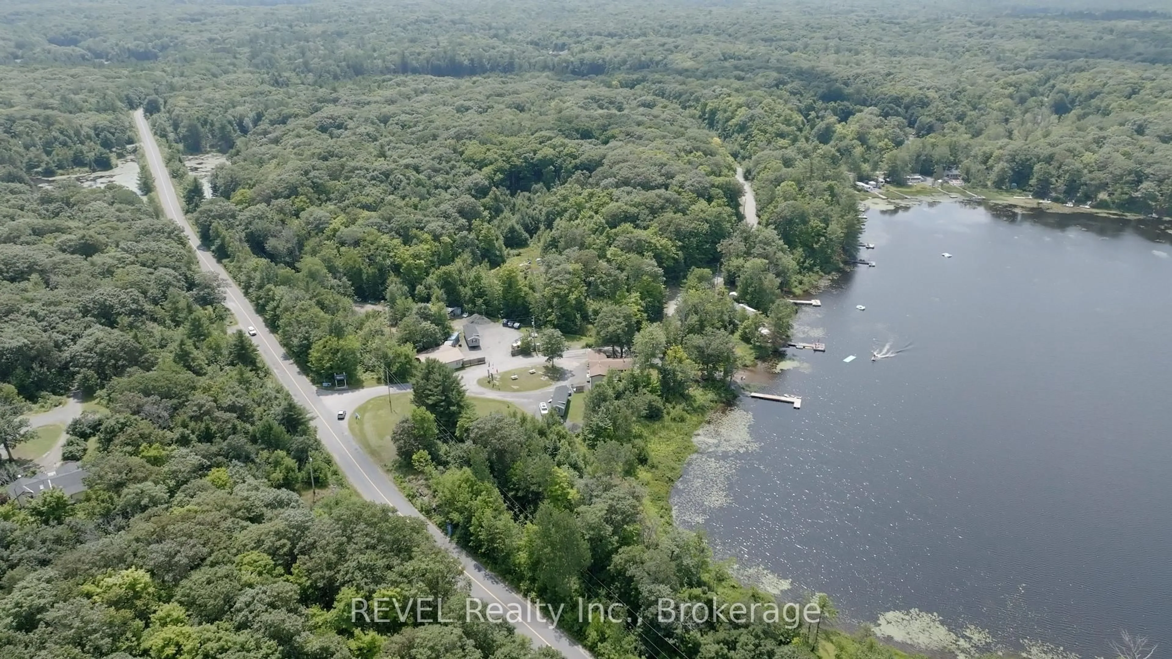 A pic from outside/outdoor area/front of a property/back of a property/a pic from drone, water/lake/river/ocean view for 105 BLUE LAKE ROAD #RL88, Seguin Ontario P2A 2W8