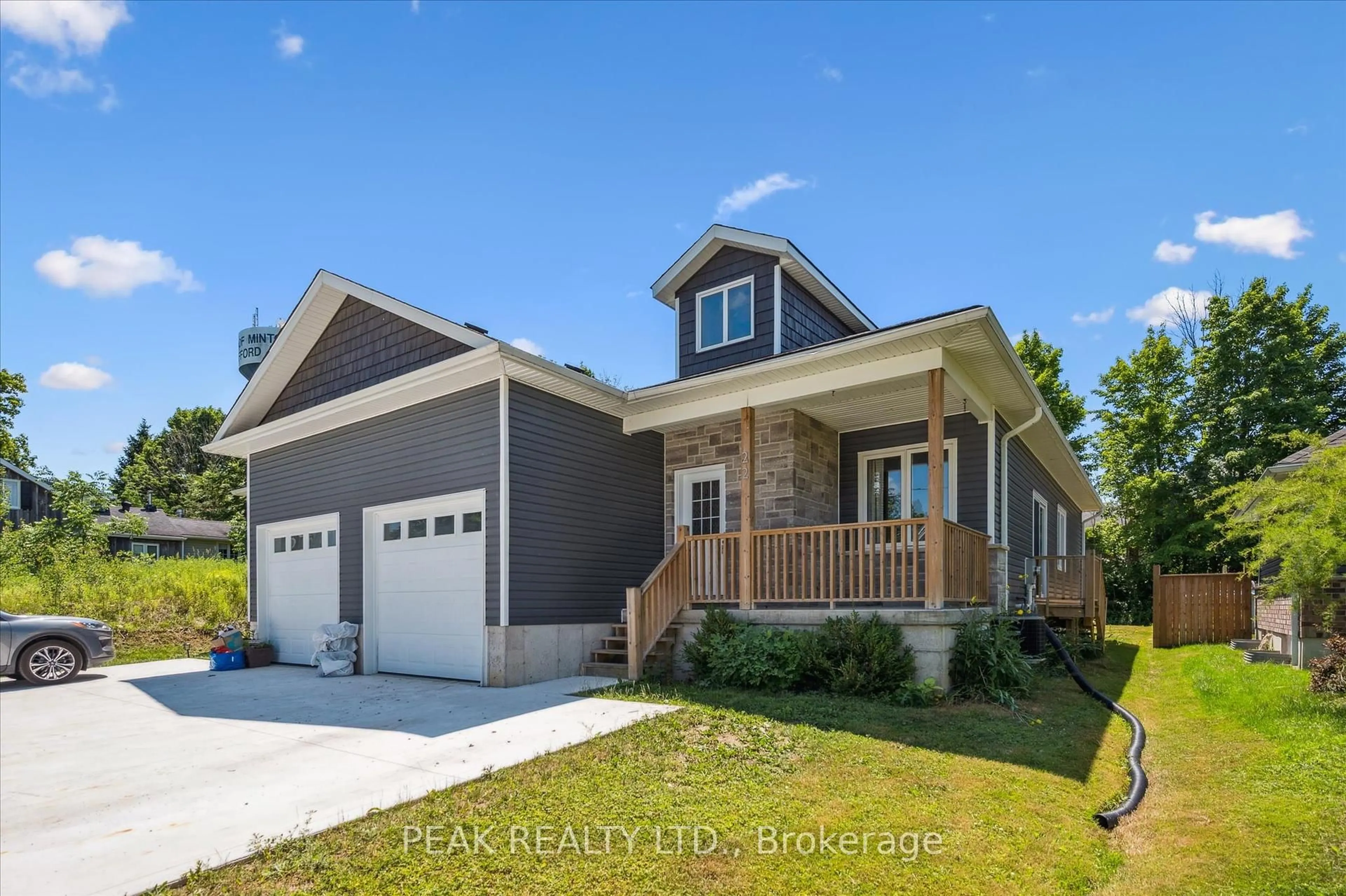 Home with vinyl exterior material, street for 22 Ann St, Minto Ontario N0G 1M0