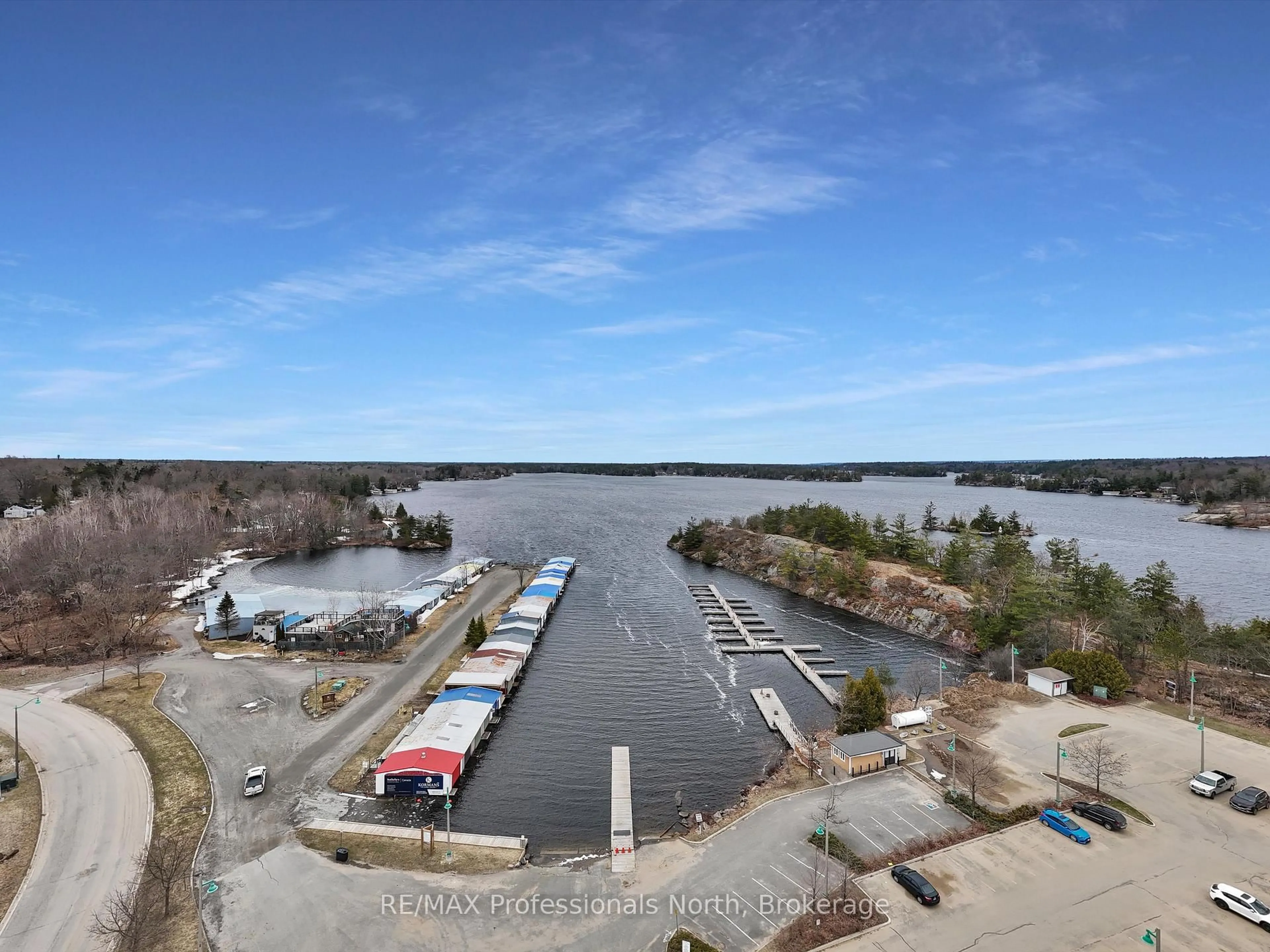 A pic from outside/outdoor area/front of a property/back of a property/a pic from drone, water/lake/river/ocean view for 130 STEAMSHIP BAY Rd #305, Gravenhurst Ontario P1P 1Z9
