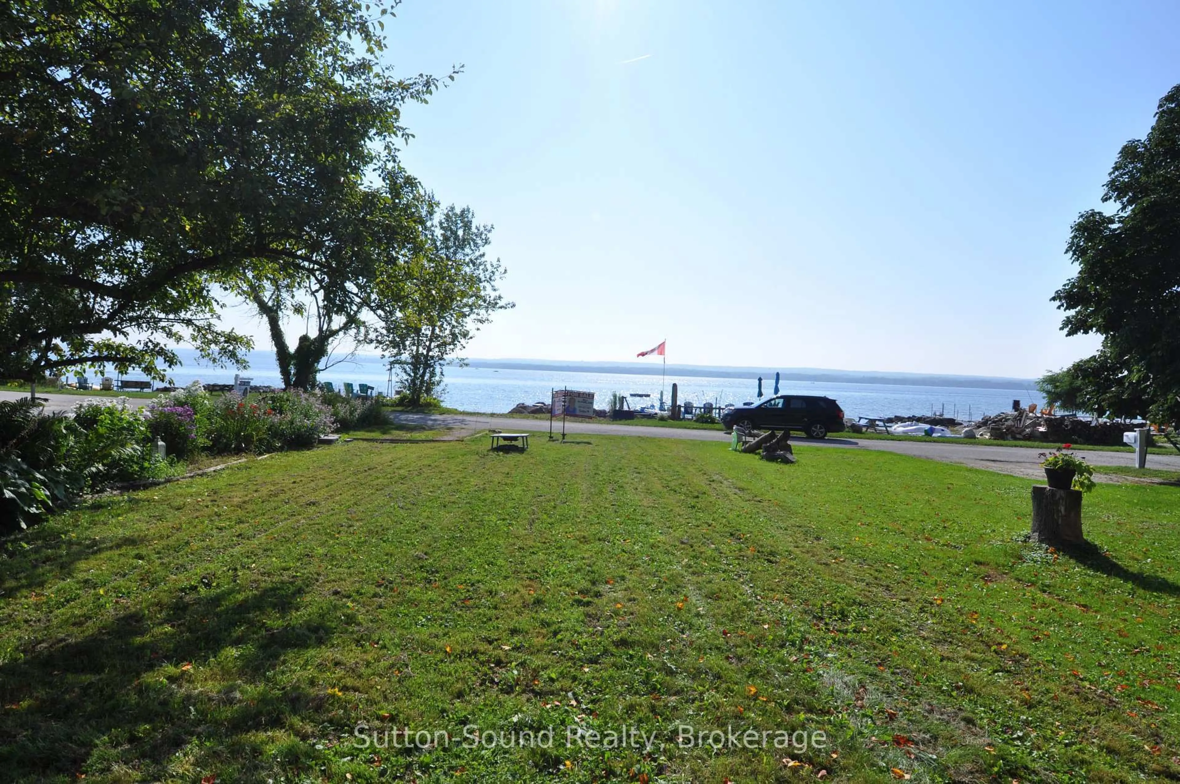 A pic from outside/outdoor area/front of a property/back of a property/a pic from drone, water/lake/river/ocean view for 166 Old Beach Dr, Georgian Bluffs Ontario N4K 5N4