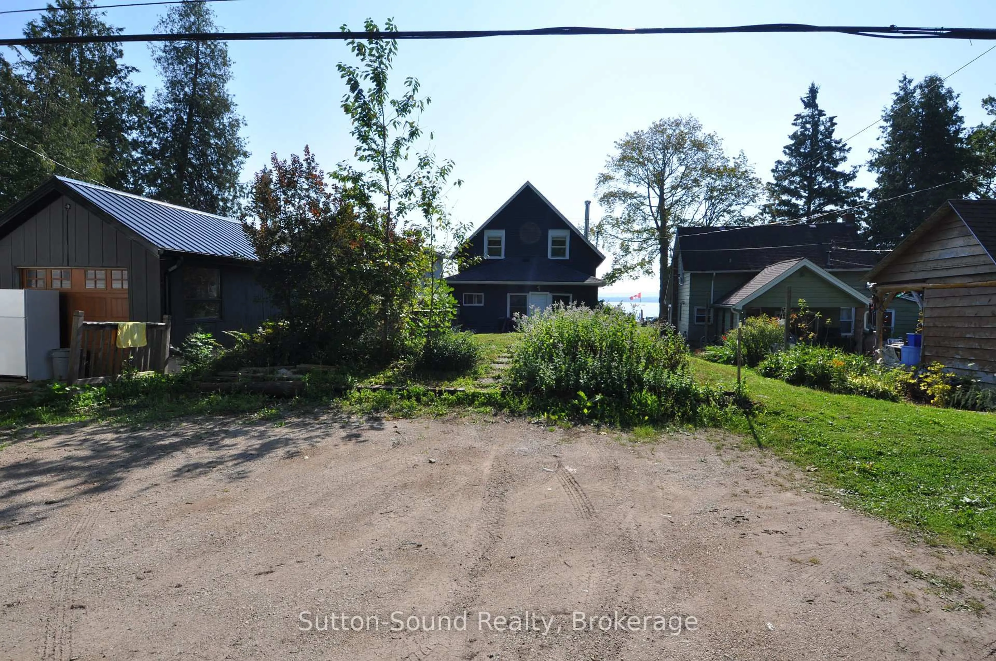 A pic from outside/outdoor area/front of a property/back of a property/a pic from drone, street for 166 Old Beach Dr, Georgian Bluffs Ontario N4K 5N4