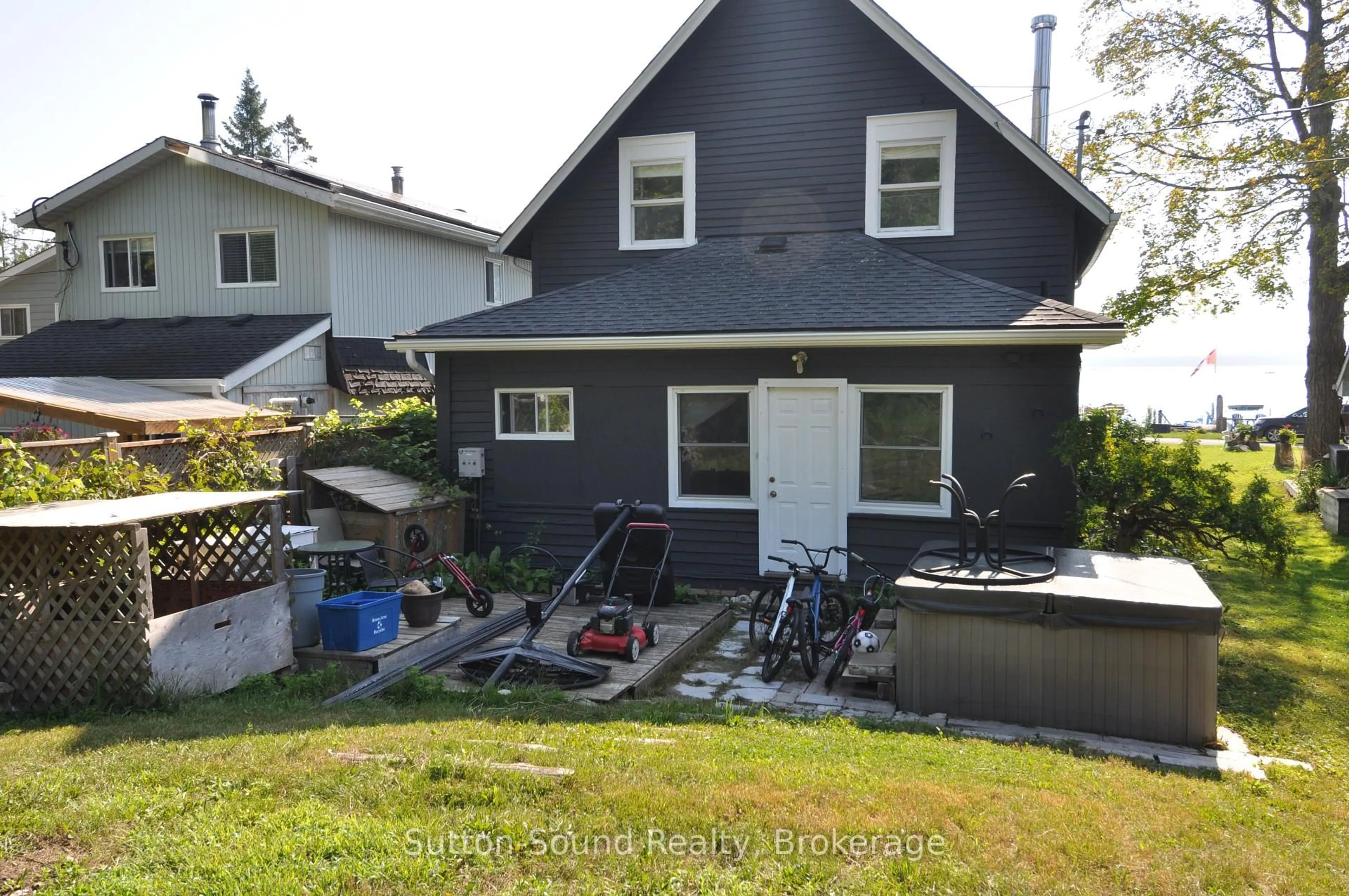 Home with vinyl exterior material, street for 166 Old Beach Dr, Georgian Bluffs Ontario N4K 5N4
