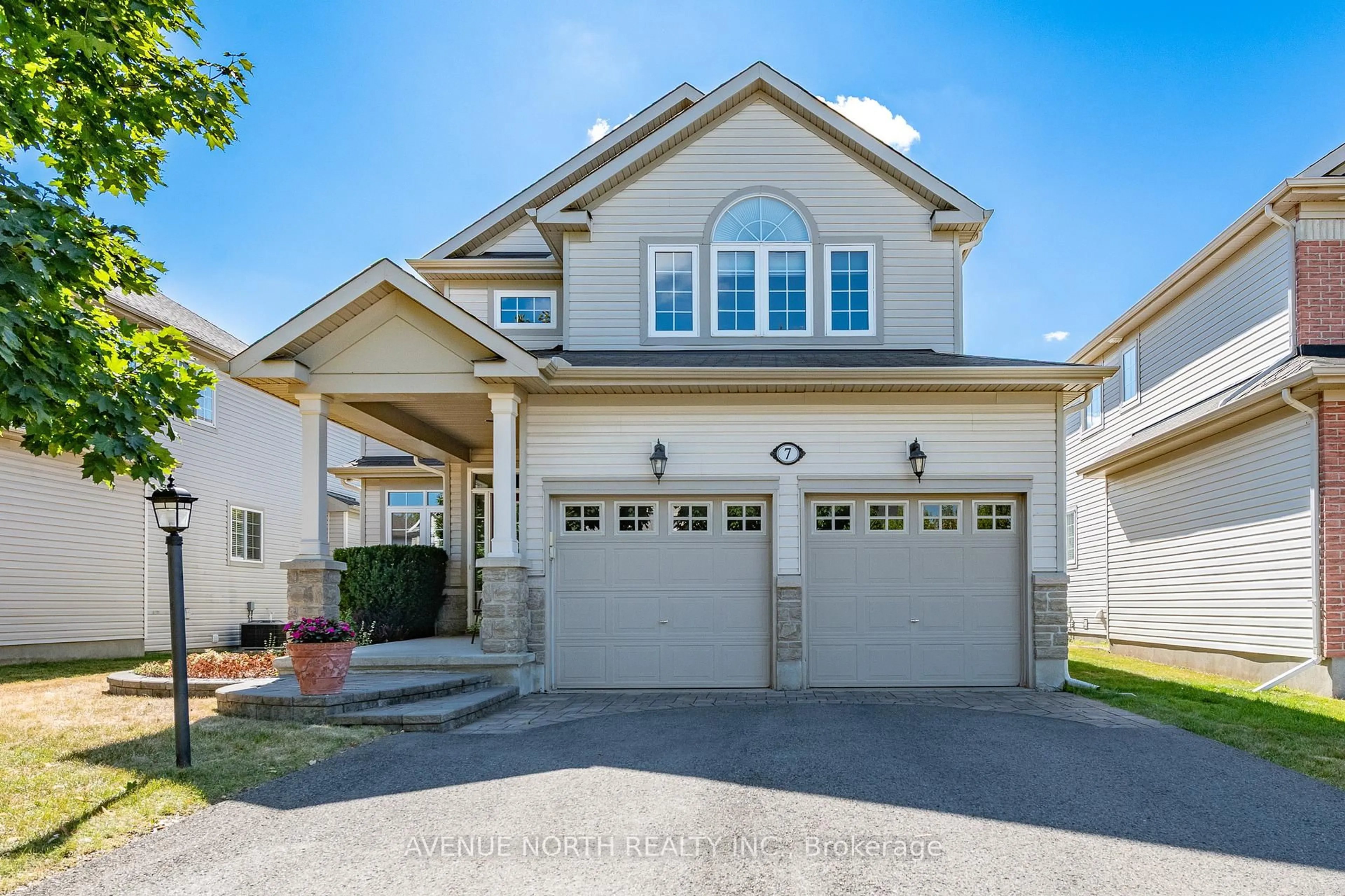 Home with vinyl exterior material, street for 7 Calderwood Way, Ottawa Ontario K2J 5L9