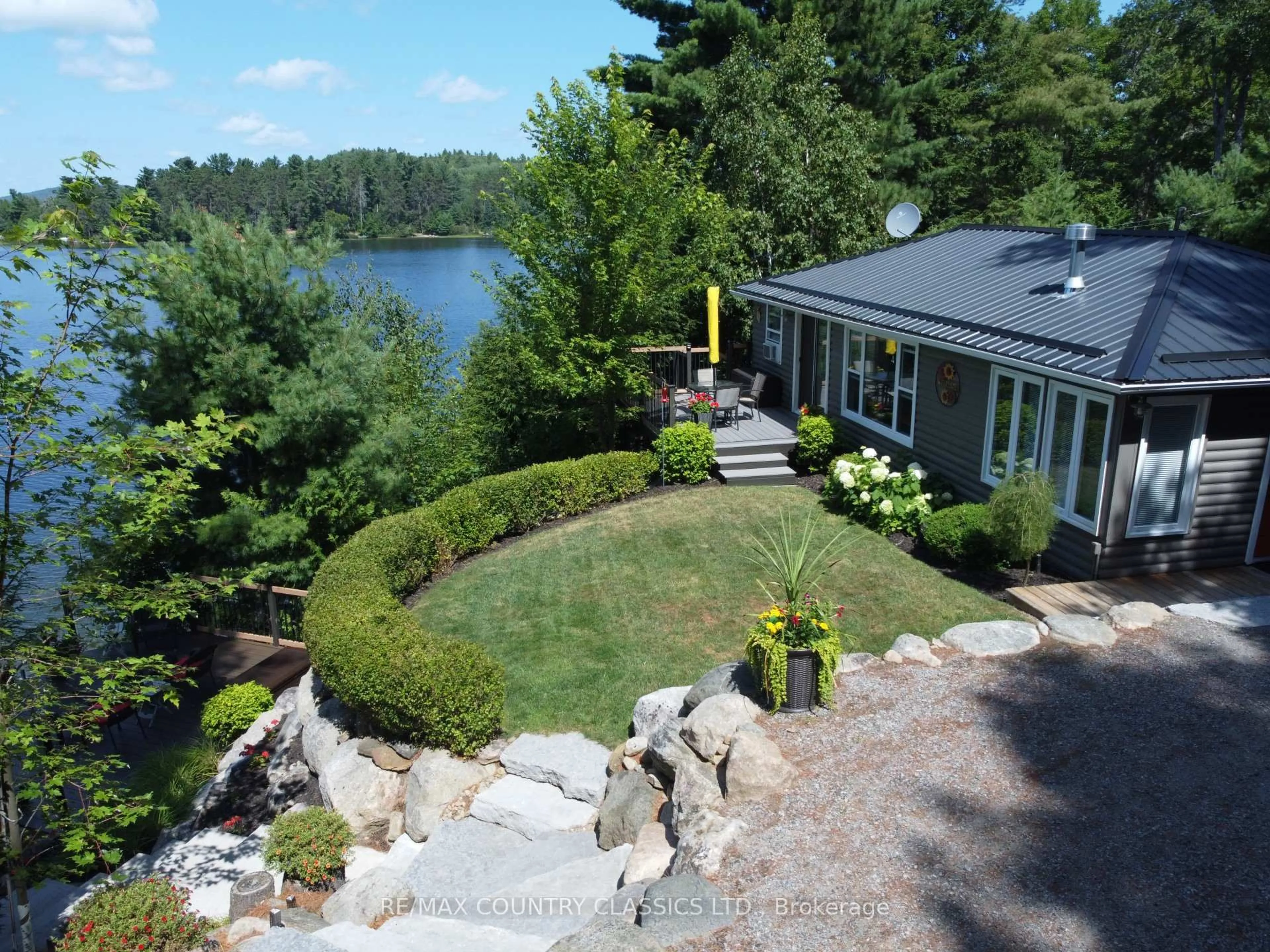 A pic from outside/outdoor area/front of a property/back of a property/a pic from drone, water/lake/river/ocean view for 156 East Side Trout Lake Lane, Barry's Bay Ontario K0J 1B0