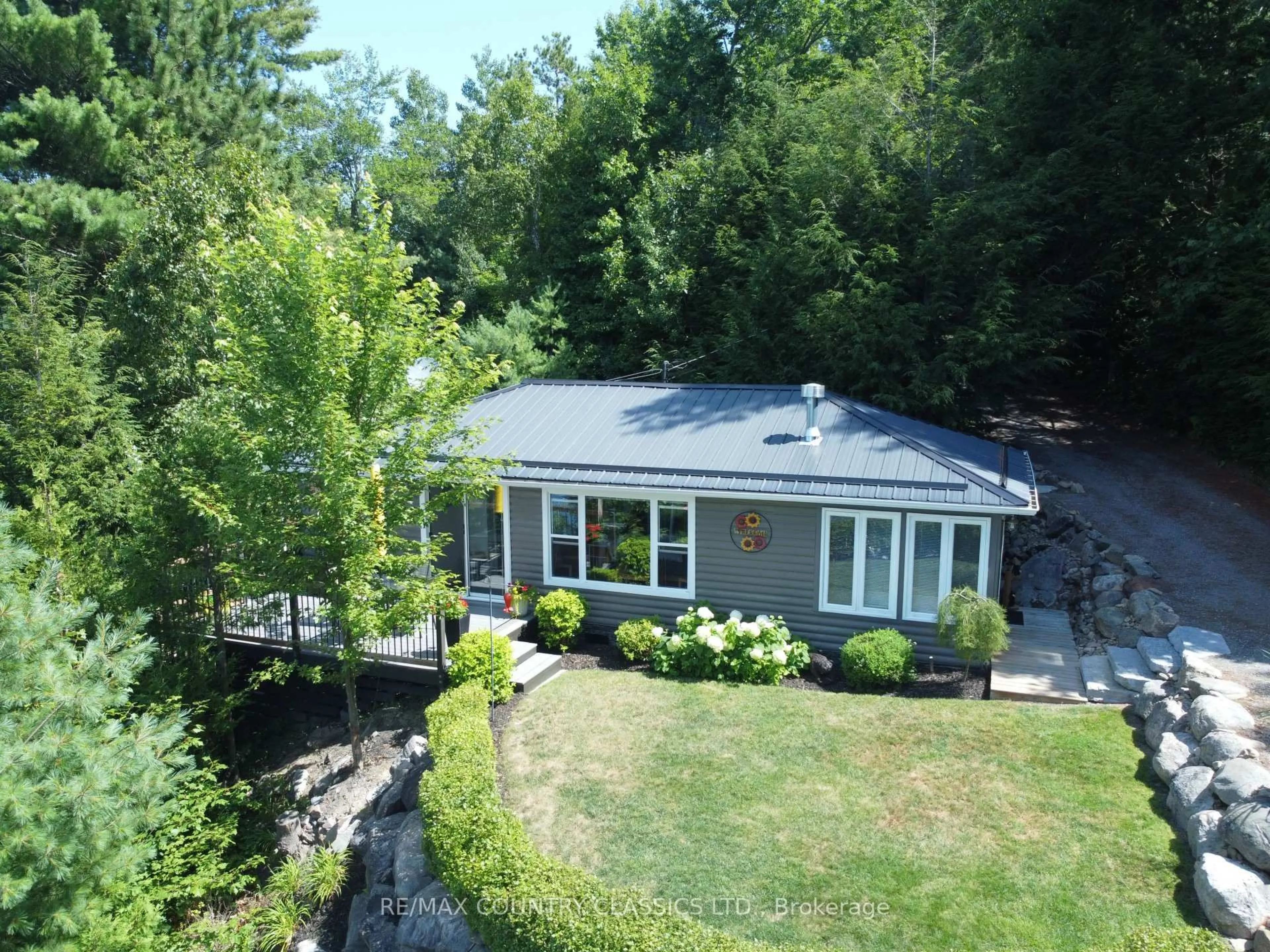 A pic from outside/outdoor area/front of a property/back of a property/a pic from drone, water/lake/river/ocean view for 156 East Side Trout Lake Lane, Barry's Bay Ontario K0J 1B0