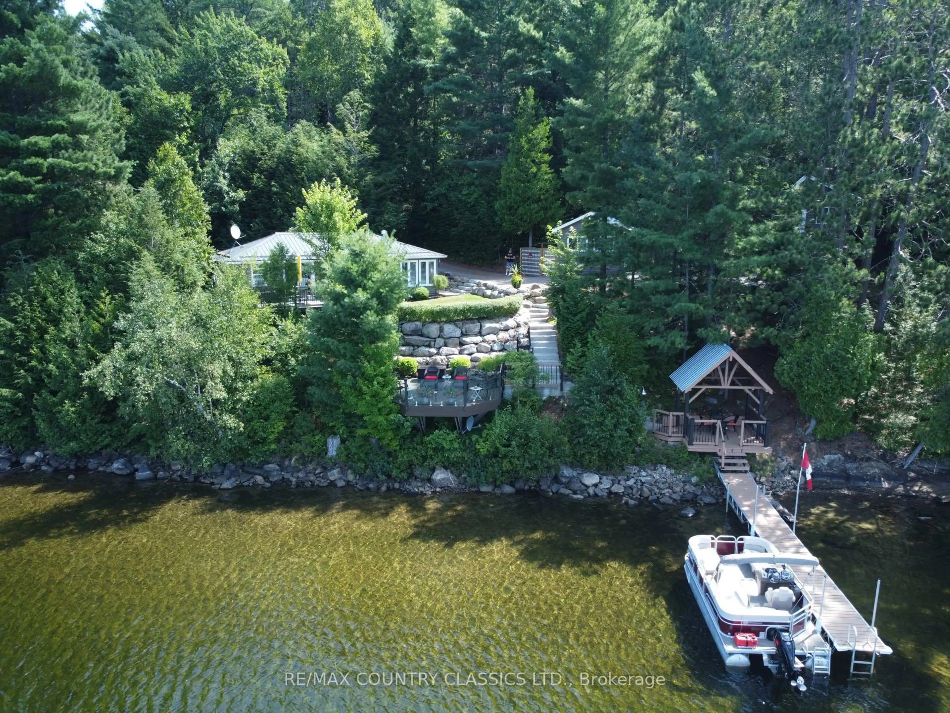 A pic from outside/outdoor area/front of a property/back of a property/a pic from drone, water/lake/river/ocean view for 156 East Side Trout Lake Lane, Barry's Bay Ontario K0J 1B0