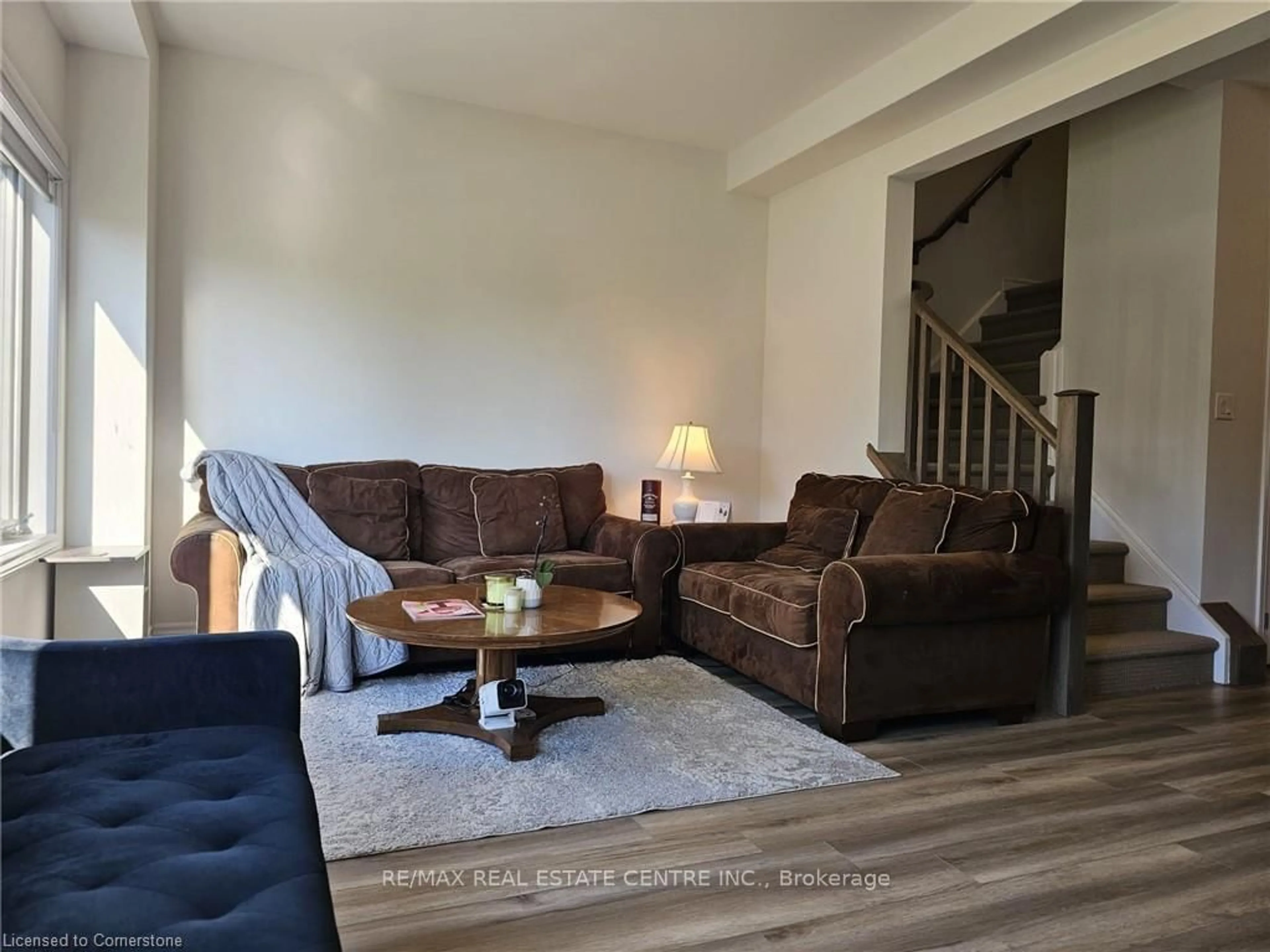 Living room with furniture, wood/laminate floor for 290 Equestrian Way #58, Cambridge Ontario N3E 0E7