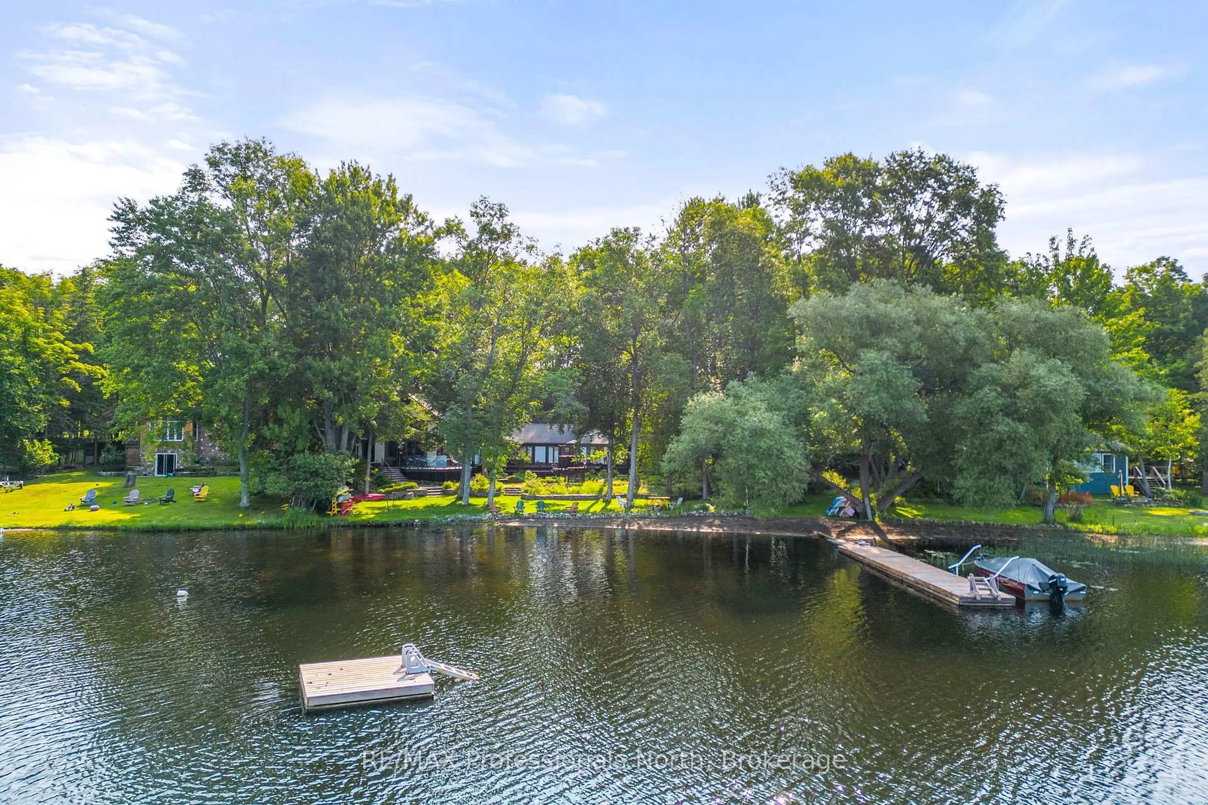 A pic from outside/outdoor area/front of a property/back of a property/a pic from drone, water/lake/river/ocean view for 1073 Grass Lake Rd, Dysart et al Ontario K0M 1S0