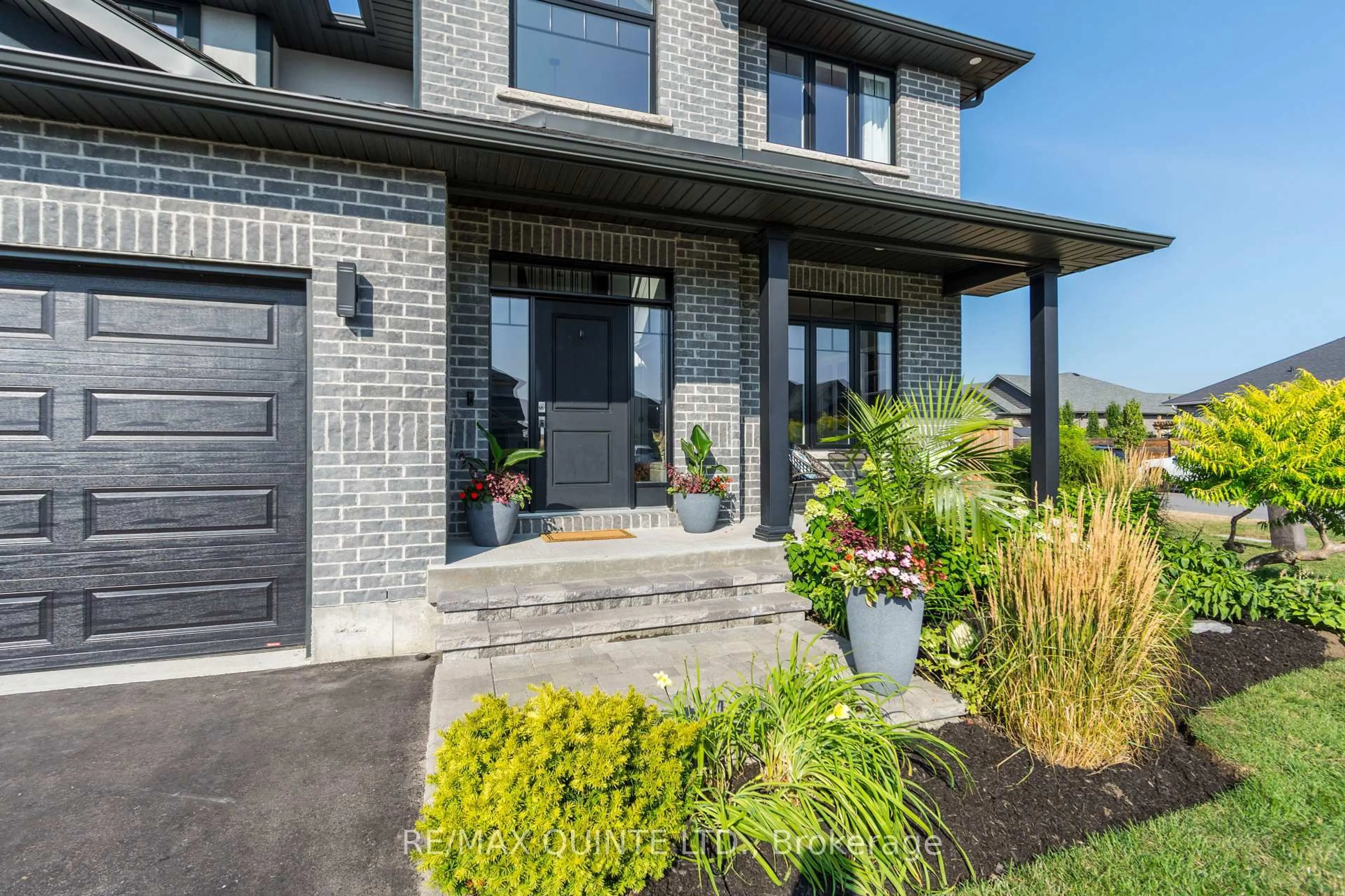 Home with brick exterior material, street for 104 Hampton Ridge Dr, Belleville Ontario K8N 0E6