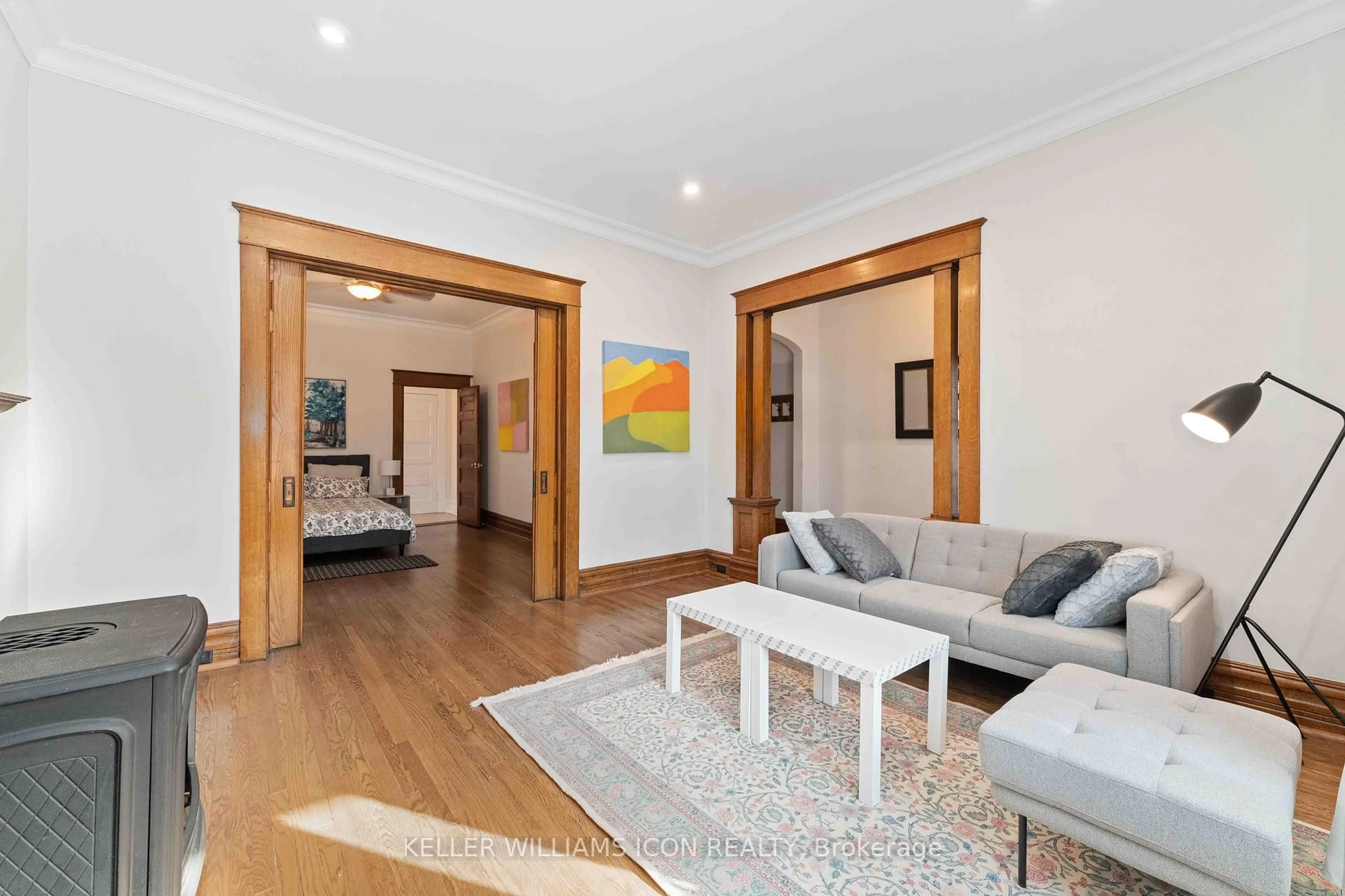 Living room with furniture, wood/laminate floor for 229 Powell Ave, Ottawa Ontario K1S 2A4