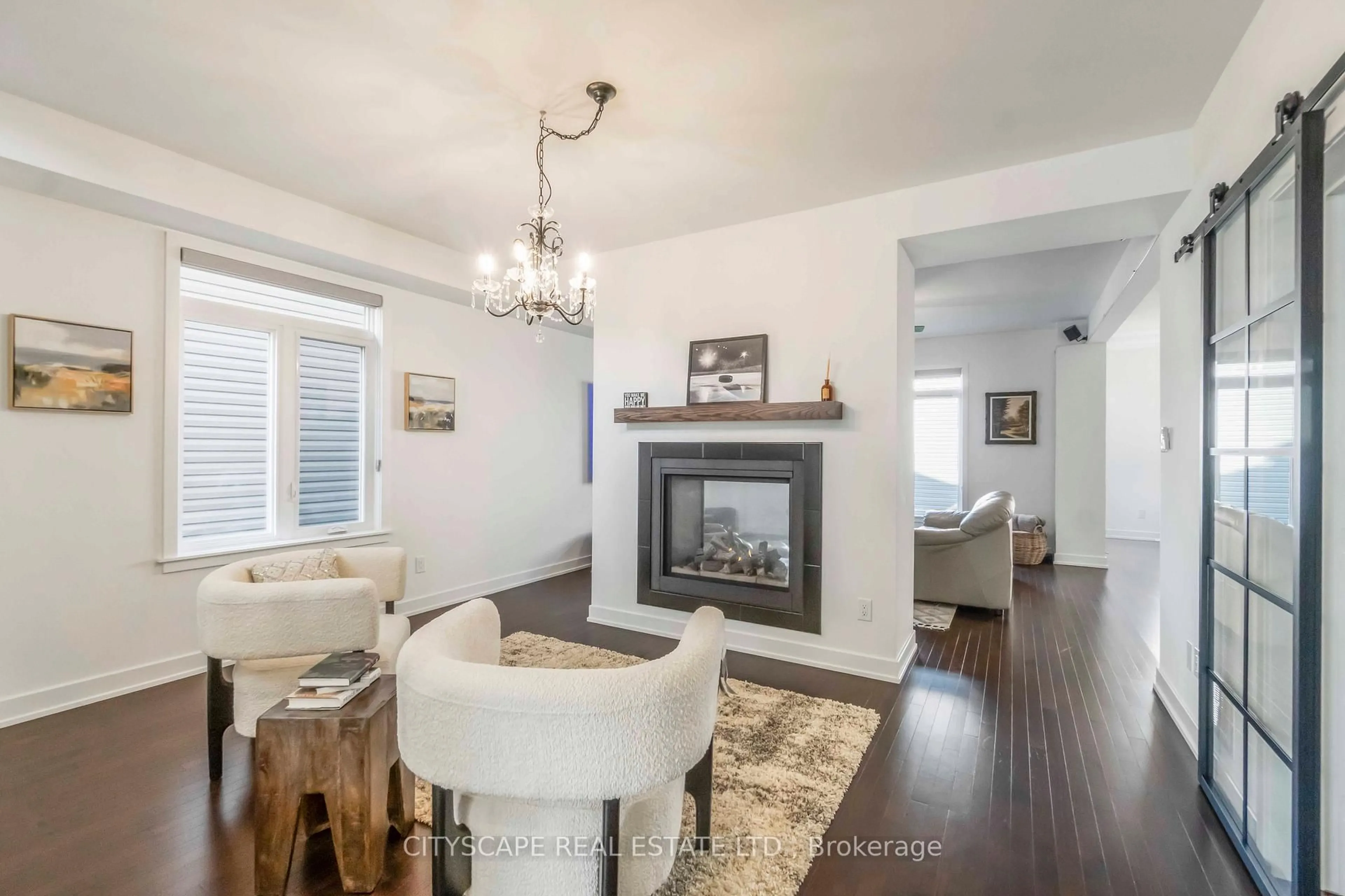 Living room with furniture, wood/laminate floor for 617 Kenabeek Terr, Ottawa Ontario K4M 0B3