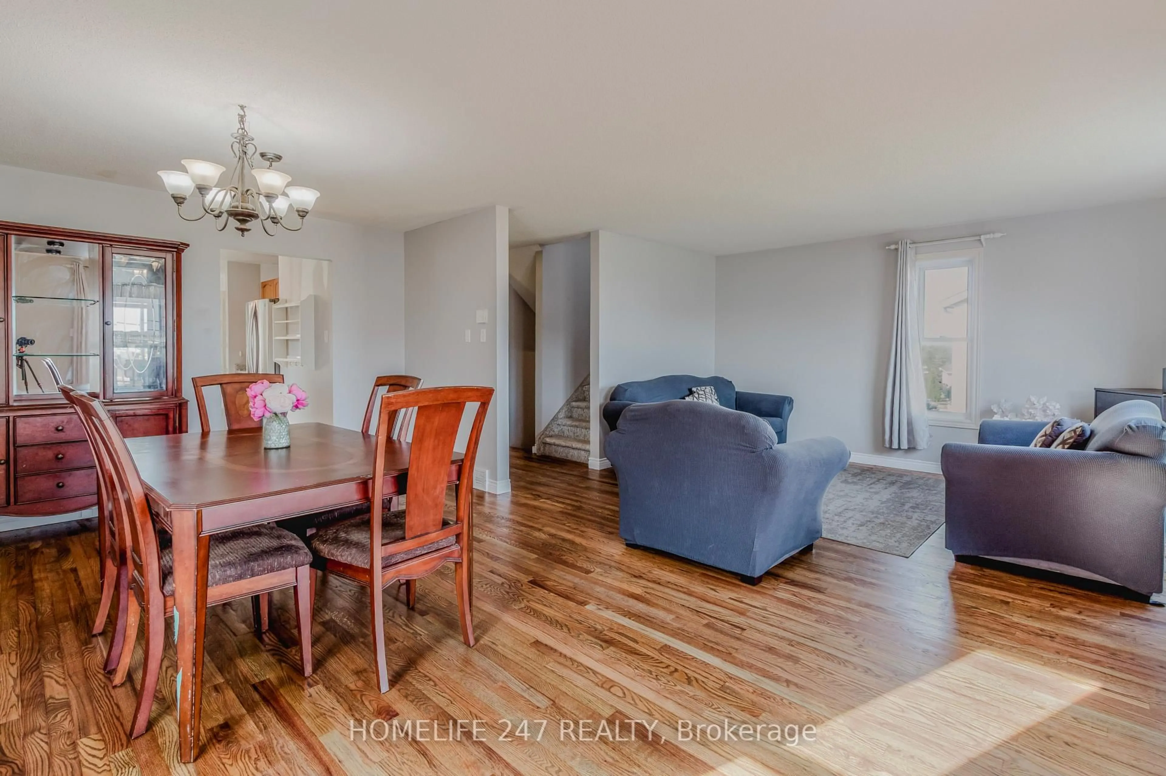 Living room with furniture, wood/laminate floor for 10 Old Orchard Glen, Woodstock Ontario N4V 1G2