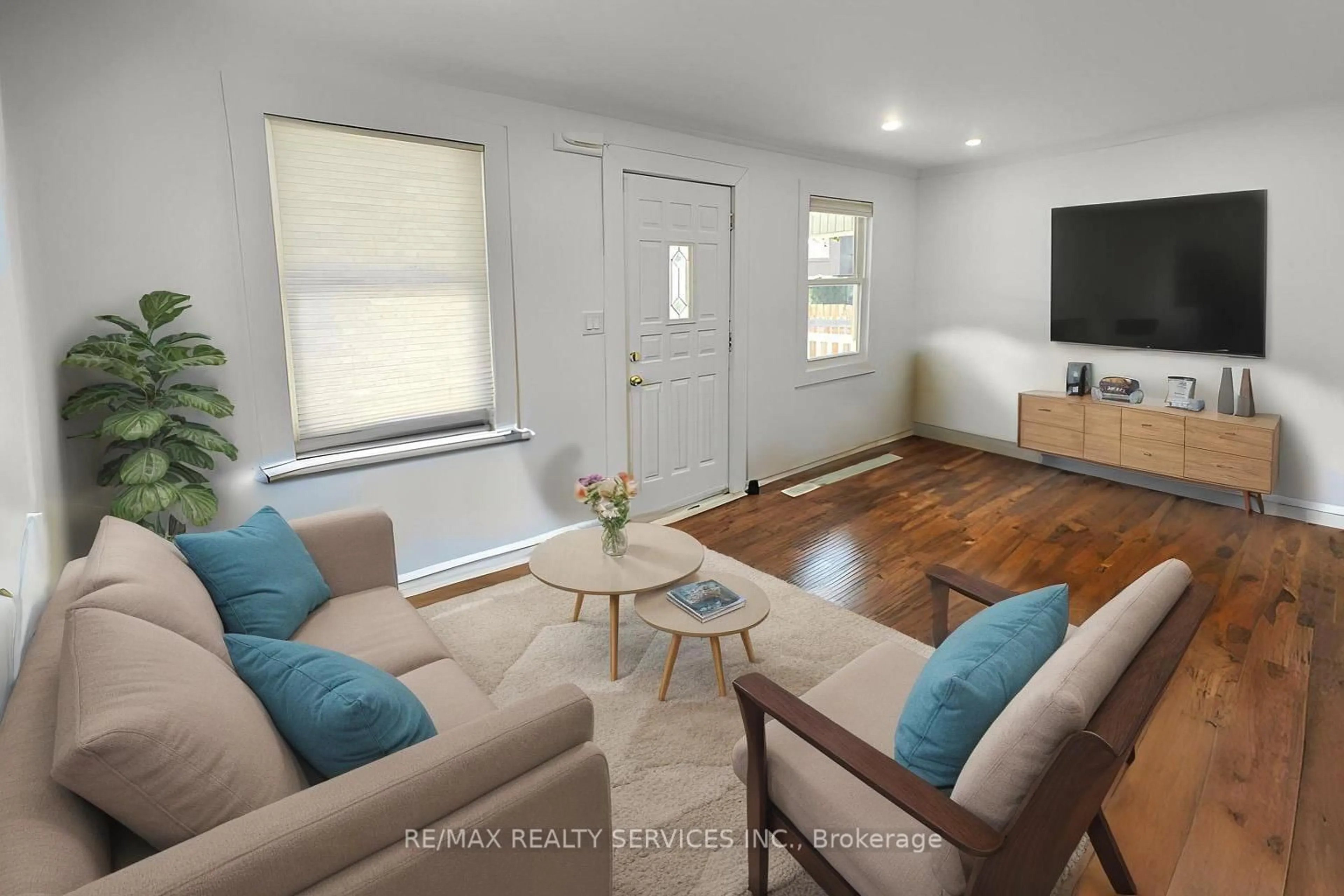 Living room with furniture, wood/laminate floor for 764 Caron Ave, Windsor Ontario N9A 5B6