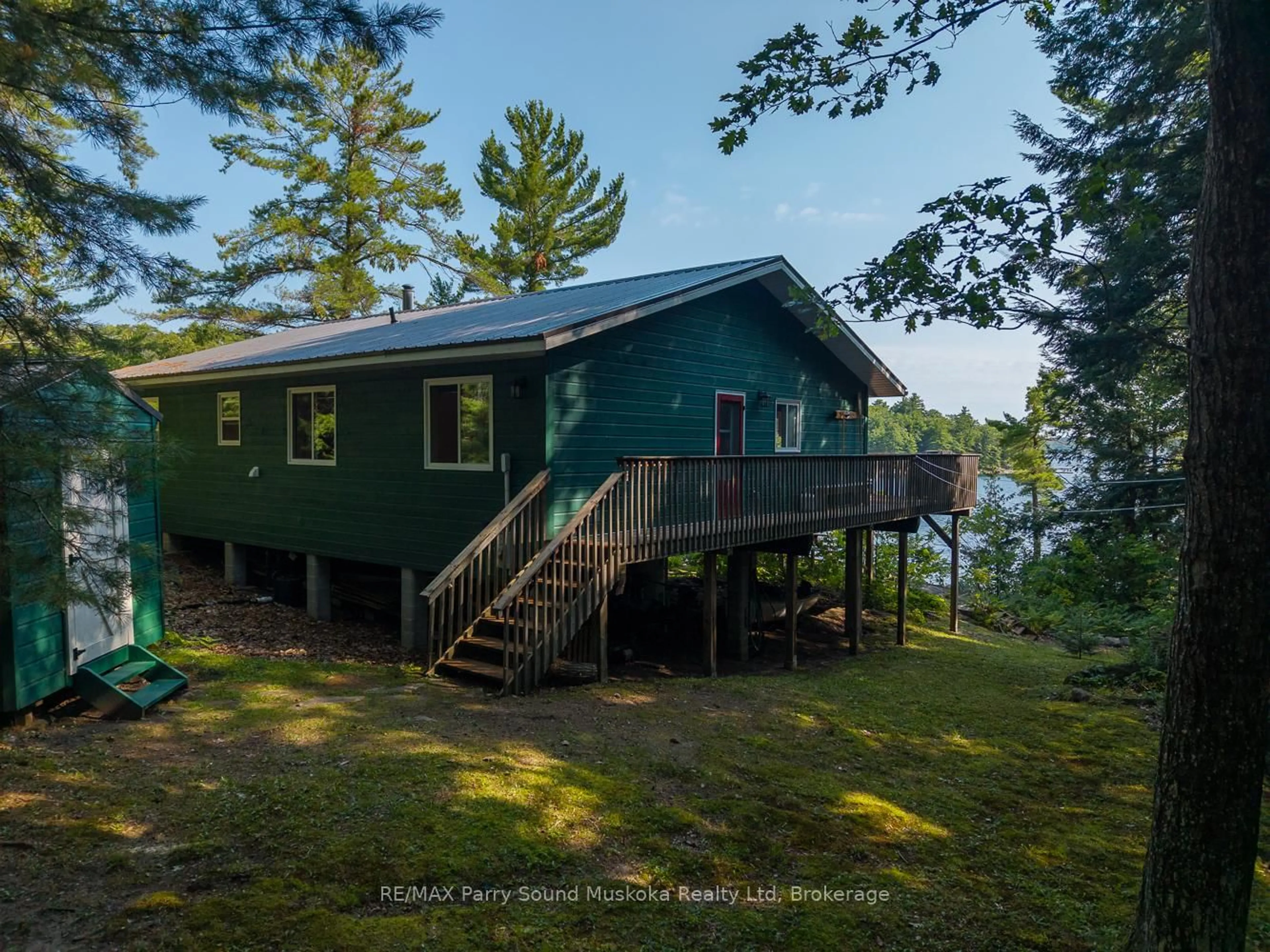 A pic from outside/outdoor area/front of a property/back of a property/a pic from drone, water/lake/river/ocean view for 47 Island 65c Island, Carling Ontario P0G 1G0