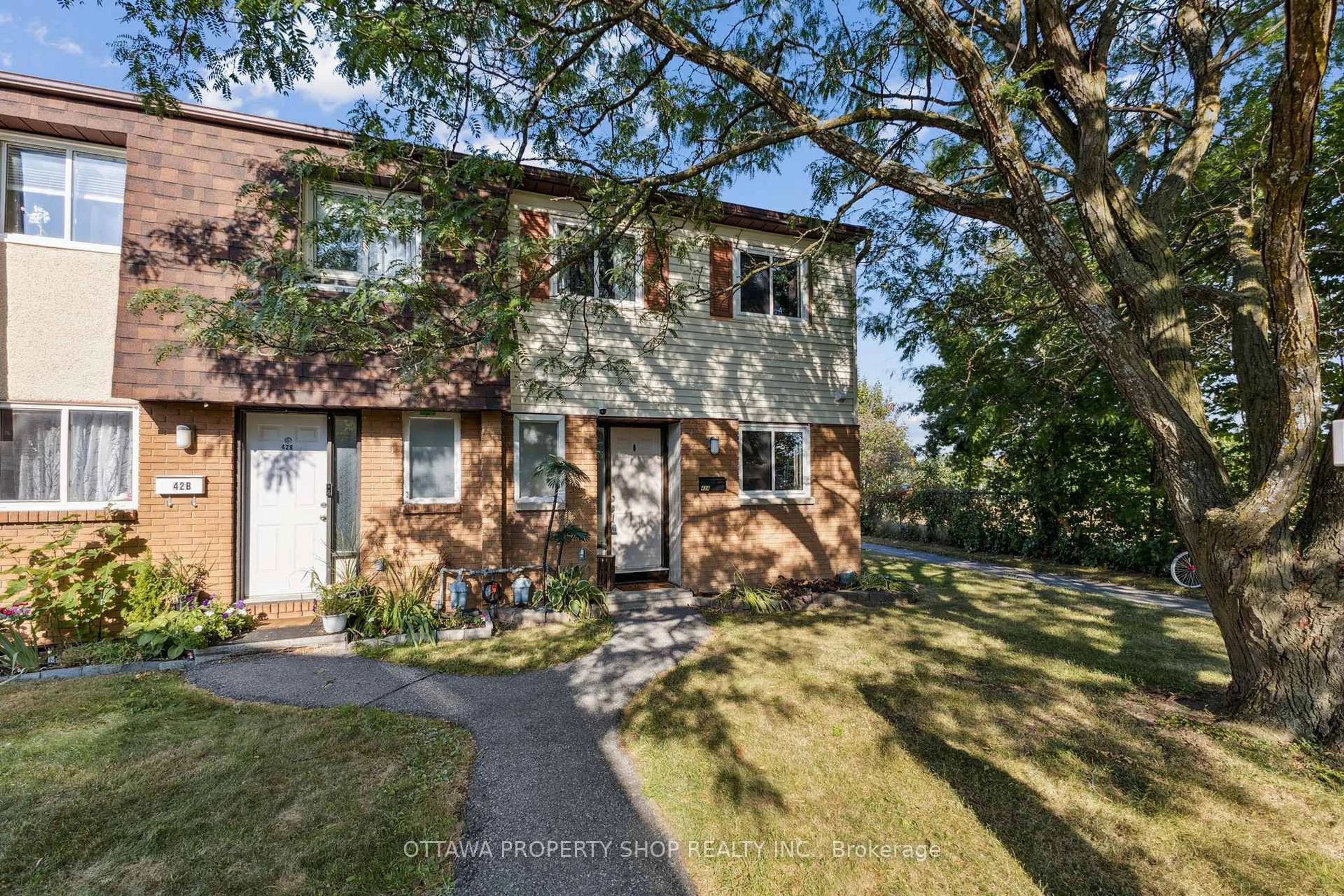 Home with brick exterior material, street for 42A Woodvale Green, Ottawa Ontario K2G 4H4