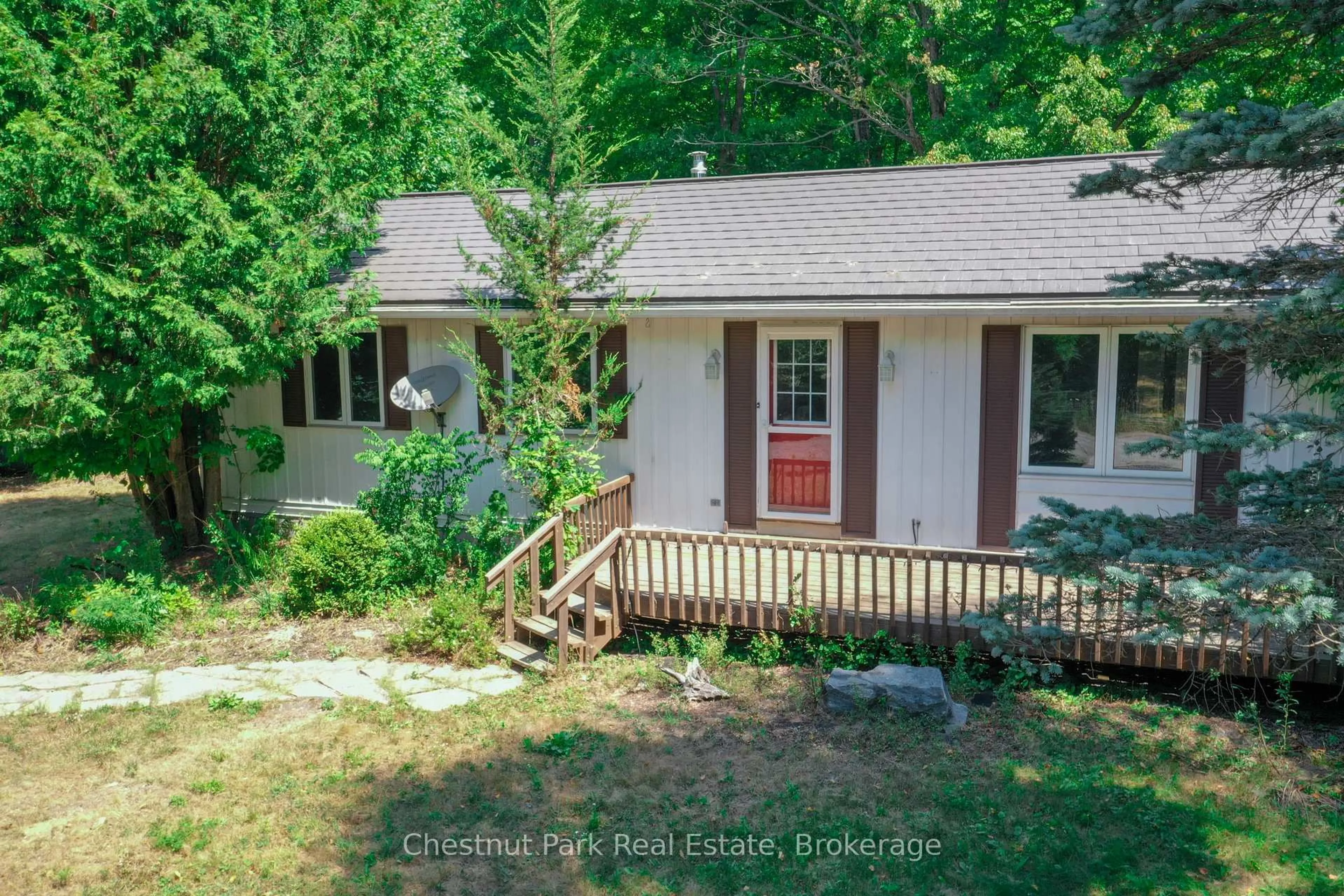 A pic from outside/outdoor area/front of a property/back of a property/a pic from drone, forest/trees view for 222 Mountain St, Dysart et al Ontario K0M 1S0