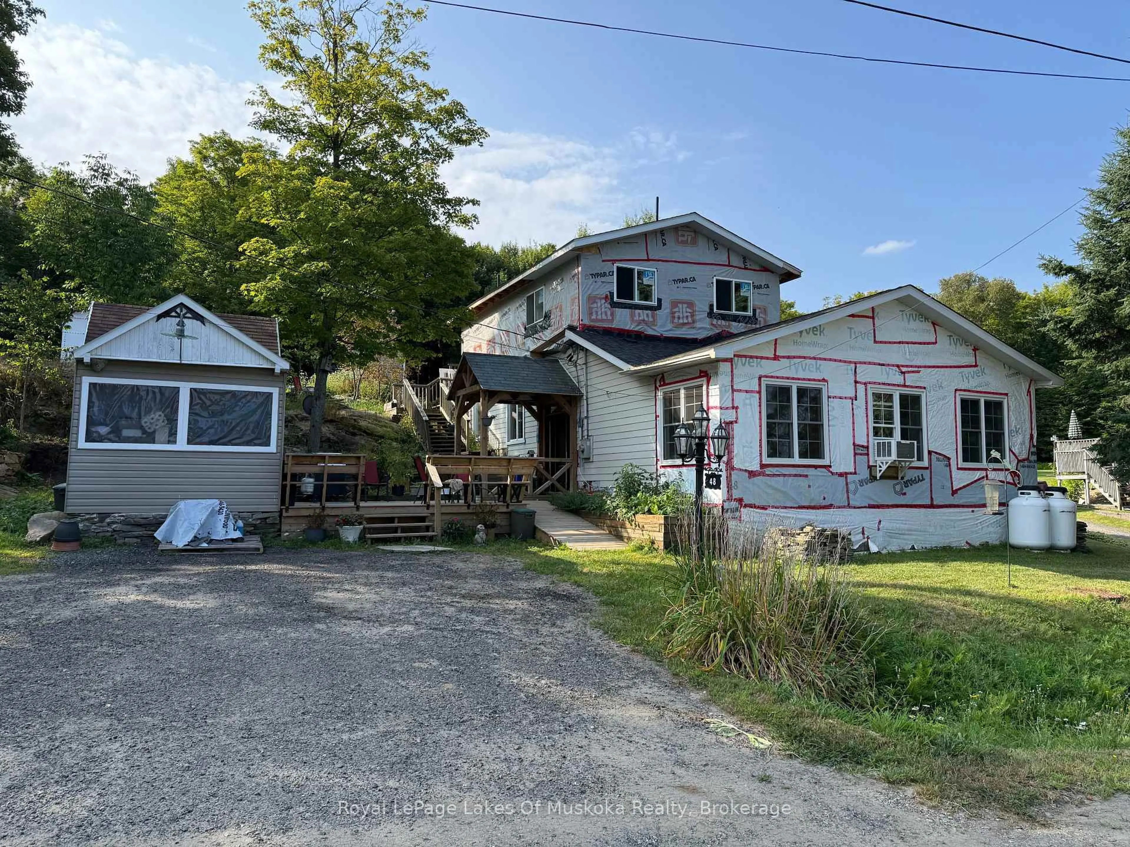 A pic from outside/outdoor area/front of a property/back of a property/a pic from drone, street for 48 Kitchen Rd, Huntsville Ontario P1H 2K8