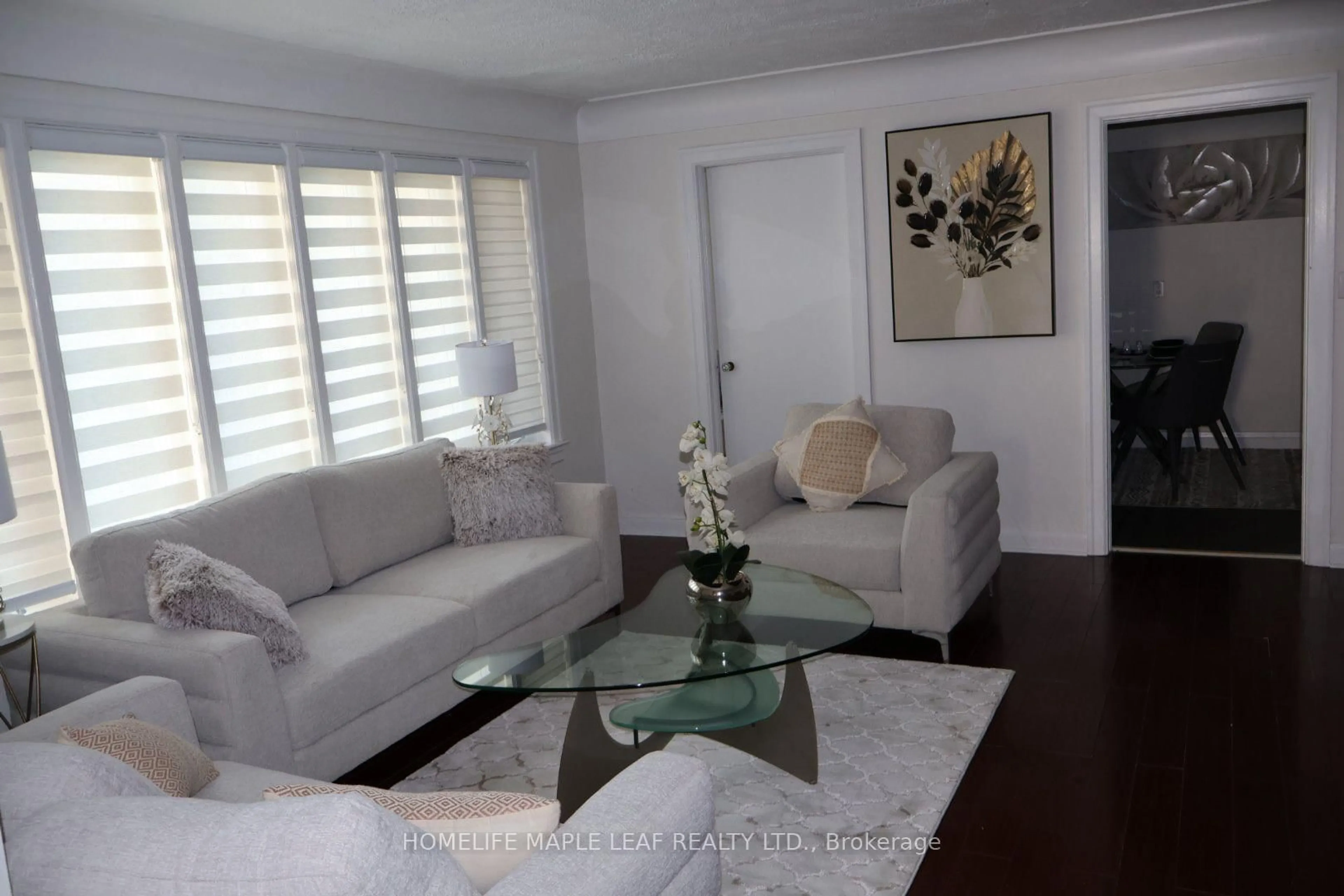 Living room with furniture, wood/laminate floor for 617 Lock St, Haldimand Ontario N1A 1V9
